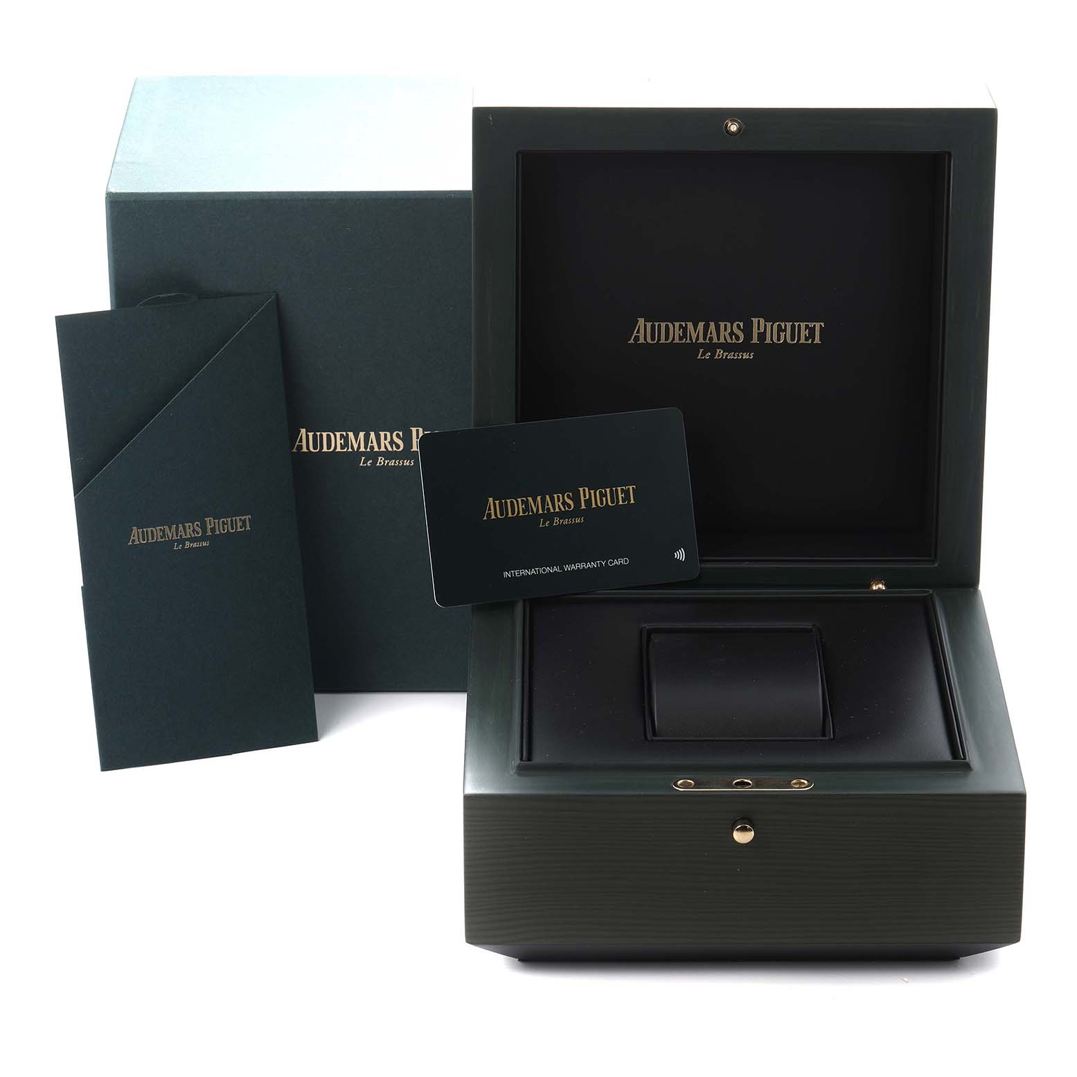 The image shows the open box, warranty card, and paperwork for the Jules model by Audemars Piguet.