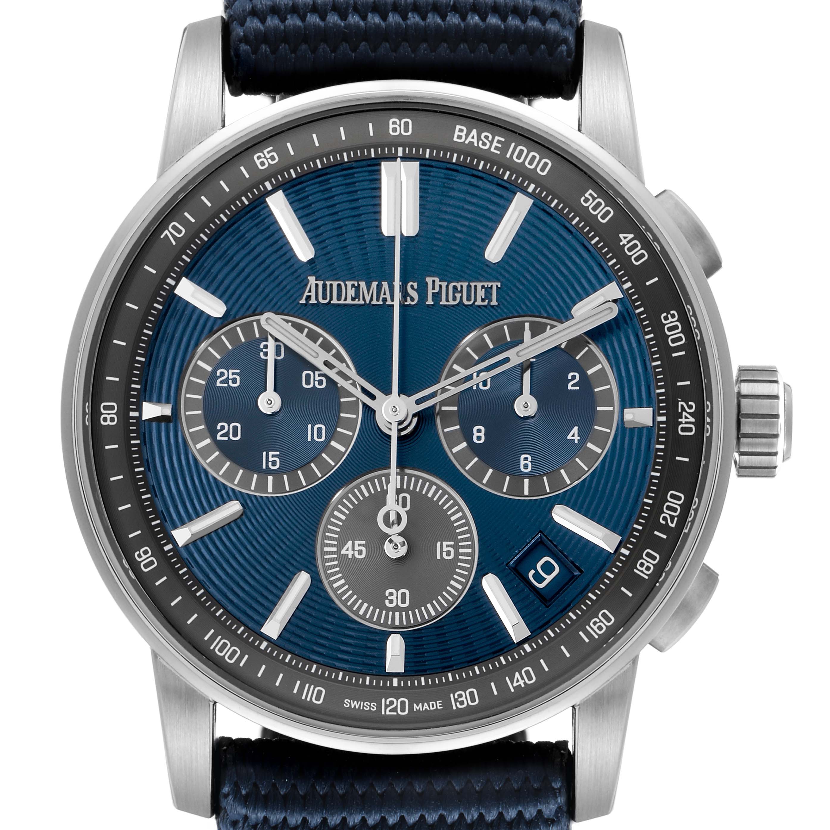The Jules model by Audemars Piguet is shown from the front, highlighting the blue dial, subdials, and crown.