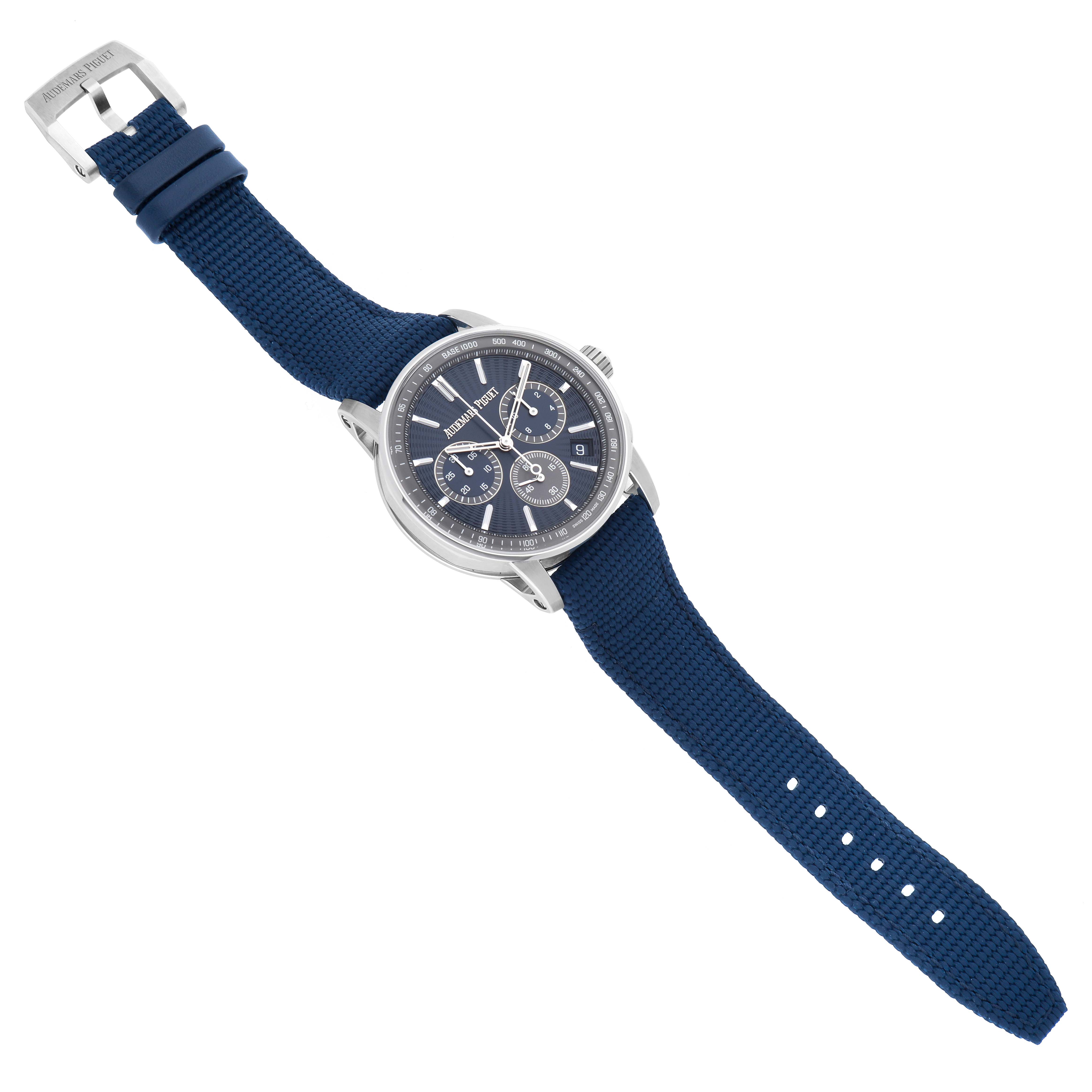 The Jules model by Audemars Piguet is shown from a top angle, displaying the face, case, and blue strap with buckle.