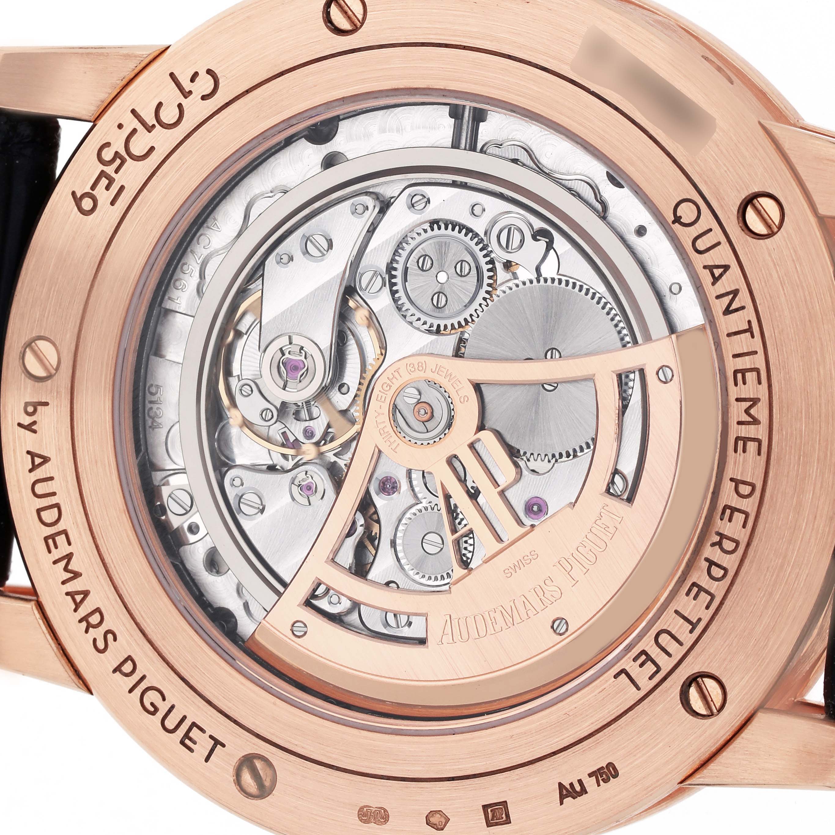 The image shows the back of the Audemars Piguet Millenary 26394OR.OO.D027KB.01 Men
s Rose Gold Blue Dial 26394OR.OO.D027KB.01 Men
s Rose Gold Blue Dial watch, focusing on its mechanical movement and engraved details.