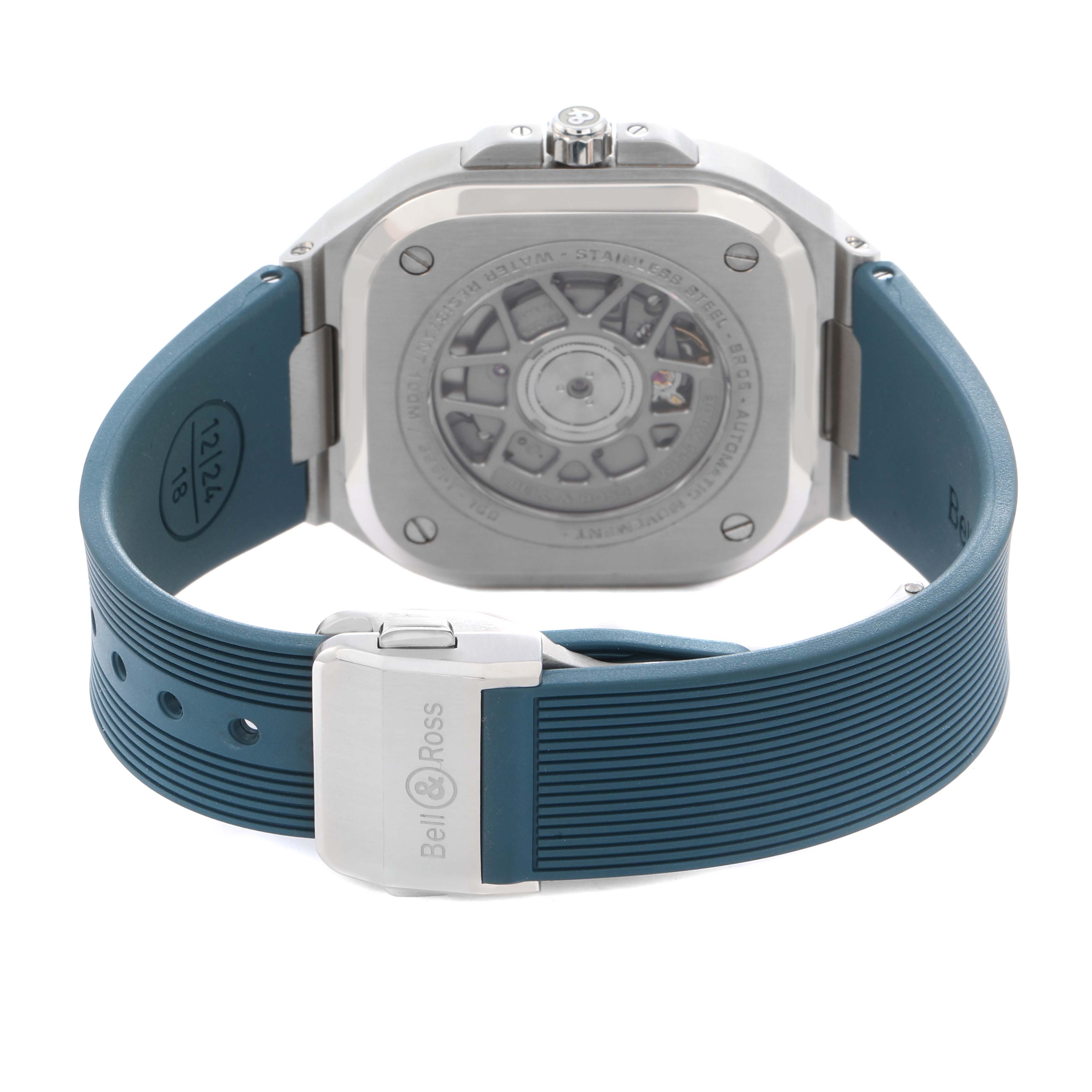 The image shows the back of a Bell 
Ross Instruments BR05G-PB-ST/SRB Men
s Stainless Steel Blue Dial BR05G-PB-ST/SRB Men
s Stainless Steel Blue Dial watch, highlighting its open case back and blue strap with clasp.