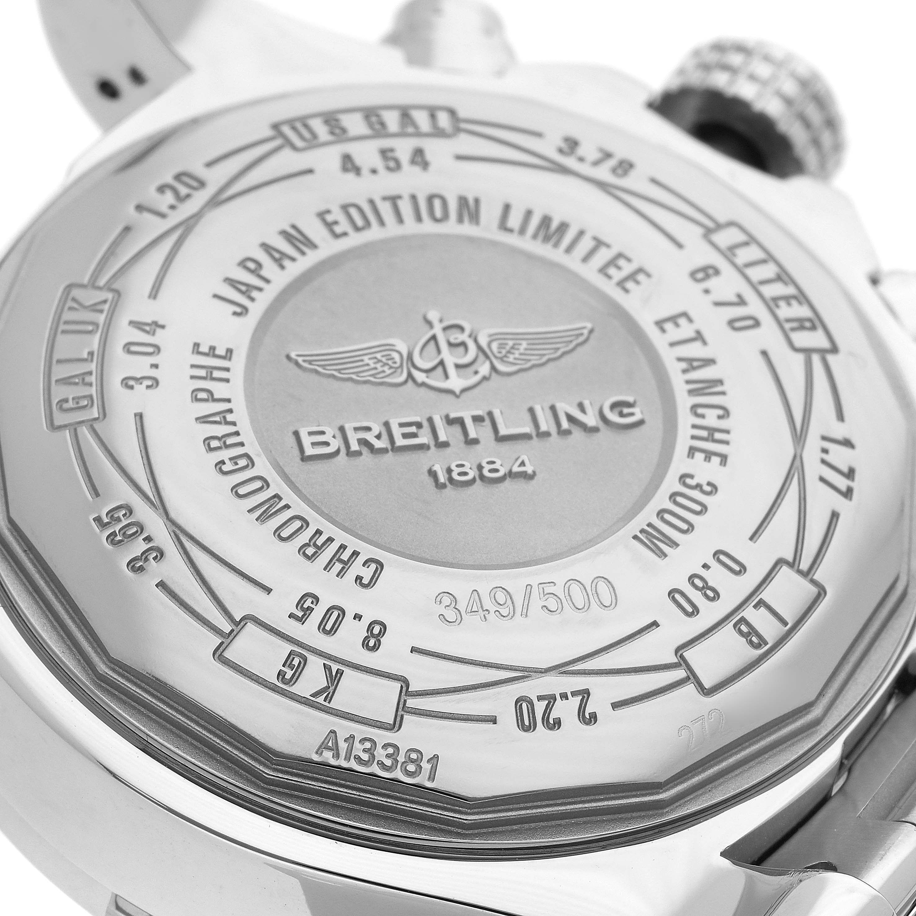 The image shows the back of a Breitling Avenger A13381 Men
s Stainless Steel White Dial A13381 Men
s Stainless Steel White Dial watch, highlighting its engravings and the crown from a rear angle.