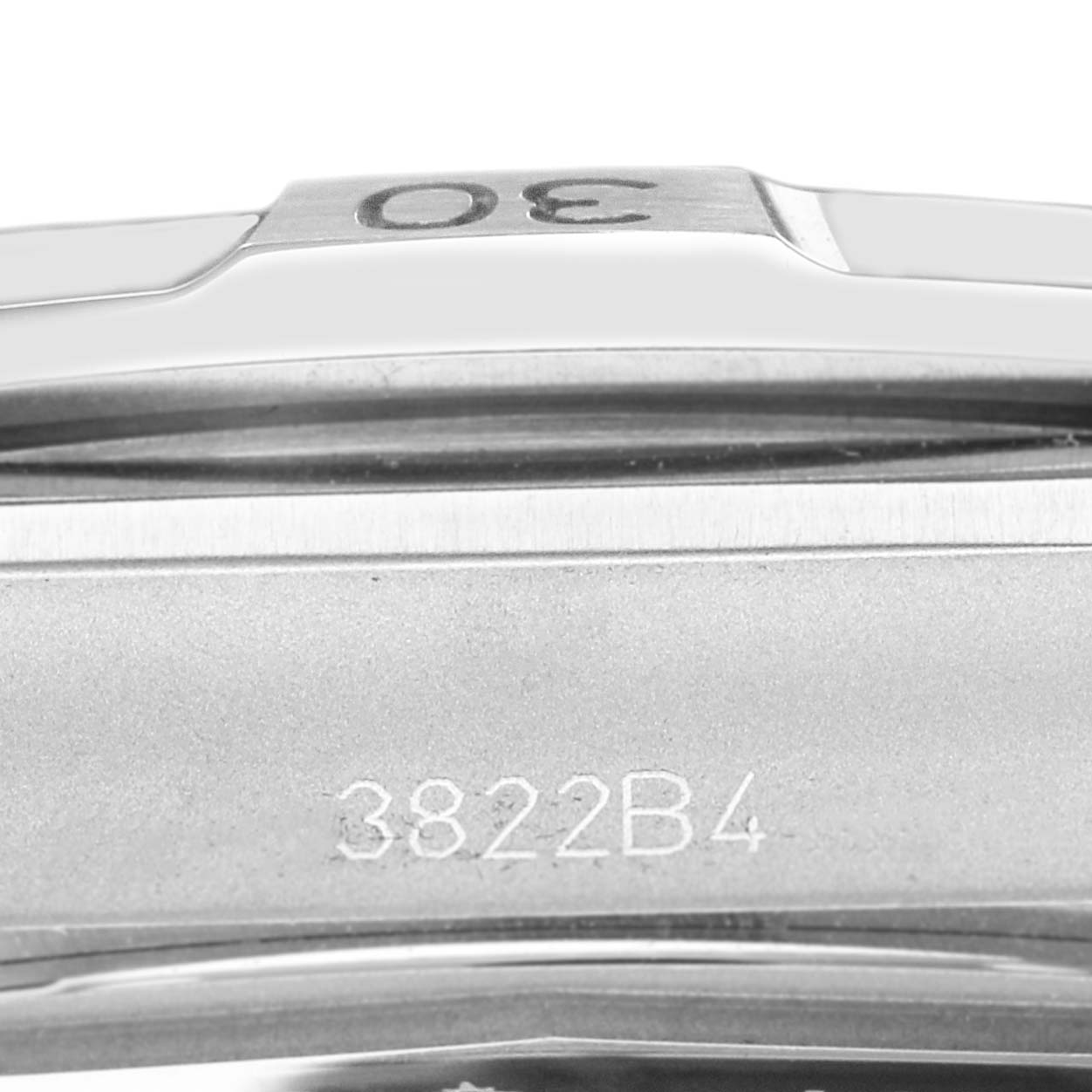 The image shows a close-up of the side of the Breitling Chronomat A32398 Men
s Stainless Steel Blue Dial A32398 Men
s Stainless Steel Blue Dial watch, highlighting its bezel markings and engraved number.