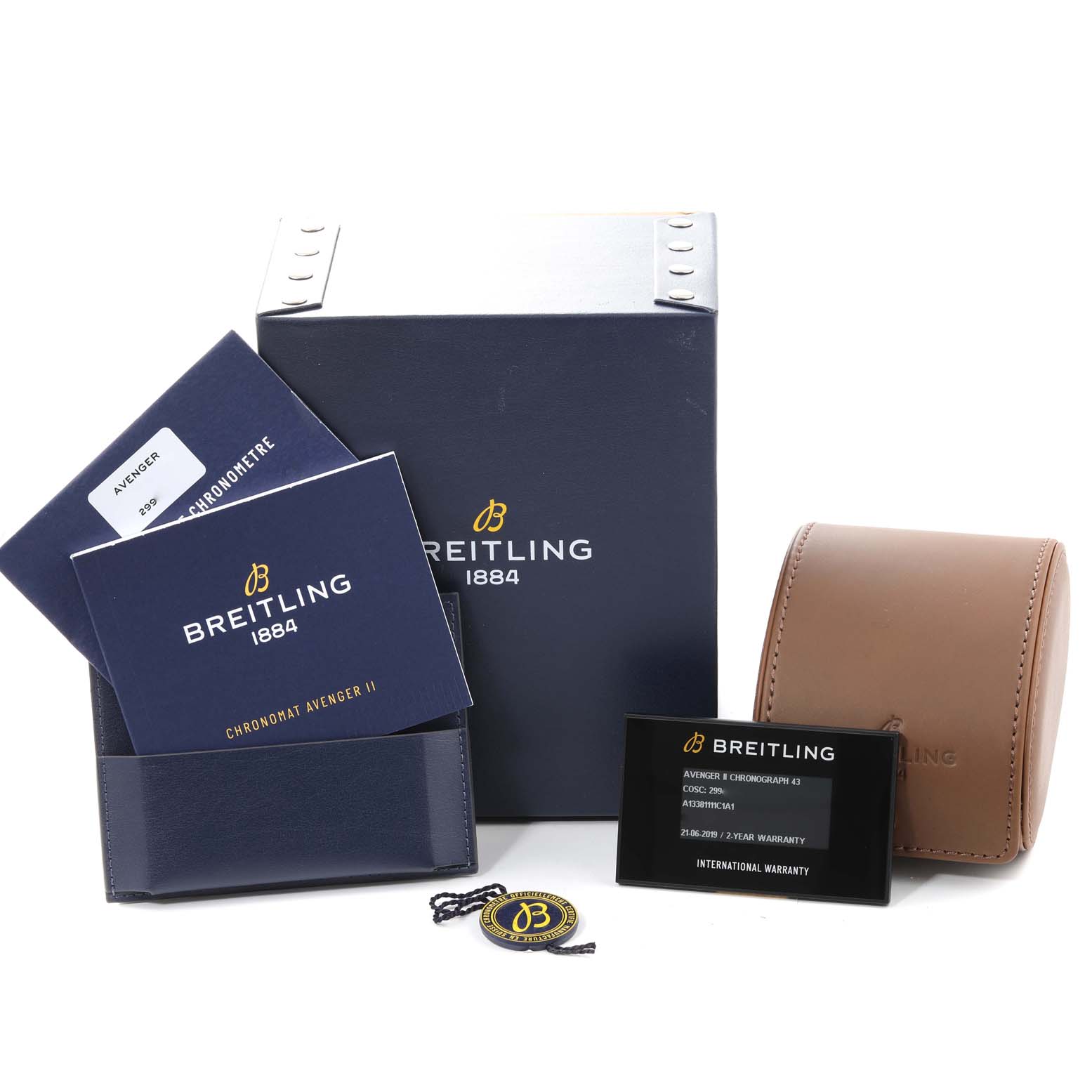 The image shows box contents of a Breitling Avenger A13381 Men's Stainless Steel Blue Dial A13381 Men's Stainless Steel Blue Dial, including manuals, a warranty card, a leather pouch, and tags, viewed from the front.