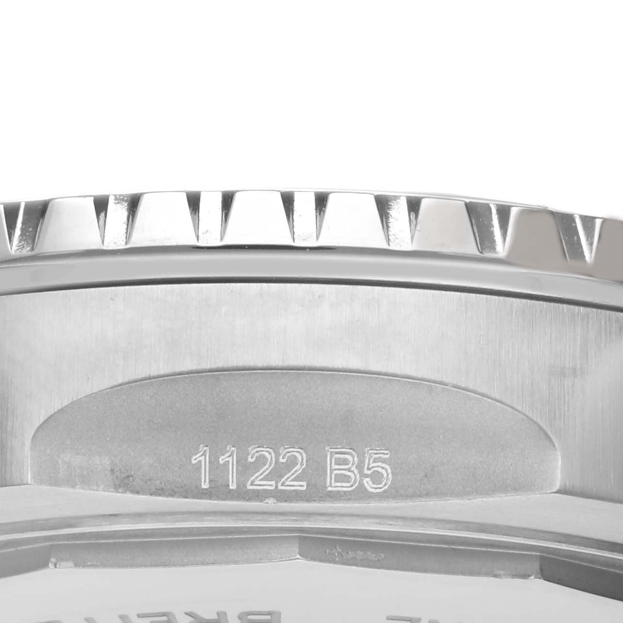 The image shows a close-up of the side profile, bezel, and engraved details of the Breitling A17377211C1A1 Women
s Stainless Steel Blue Dial A17377211C1A1 Women
s Stainless Steel Blue Dial Superocean 36 model.