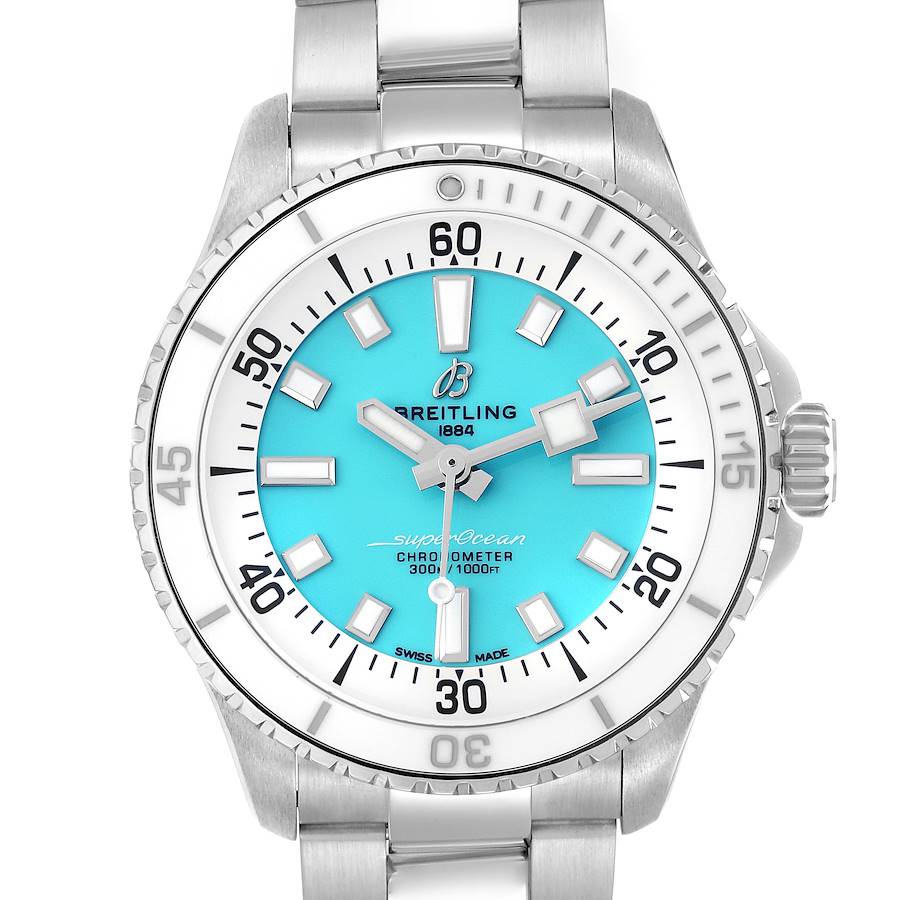 The Breitling Superocean 36 is shown from the front, highlighting its blue dial, white markers, and stainless steel bracelet.