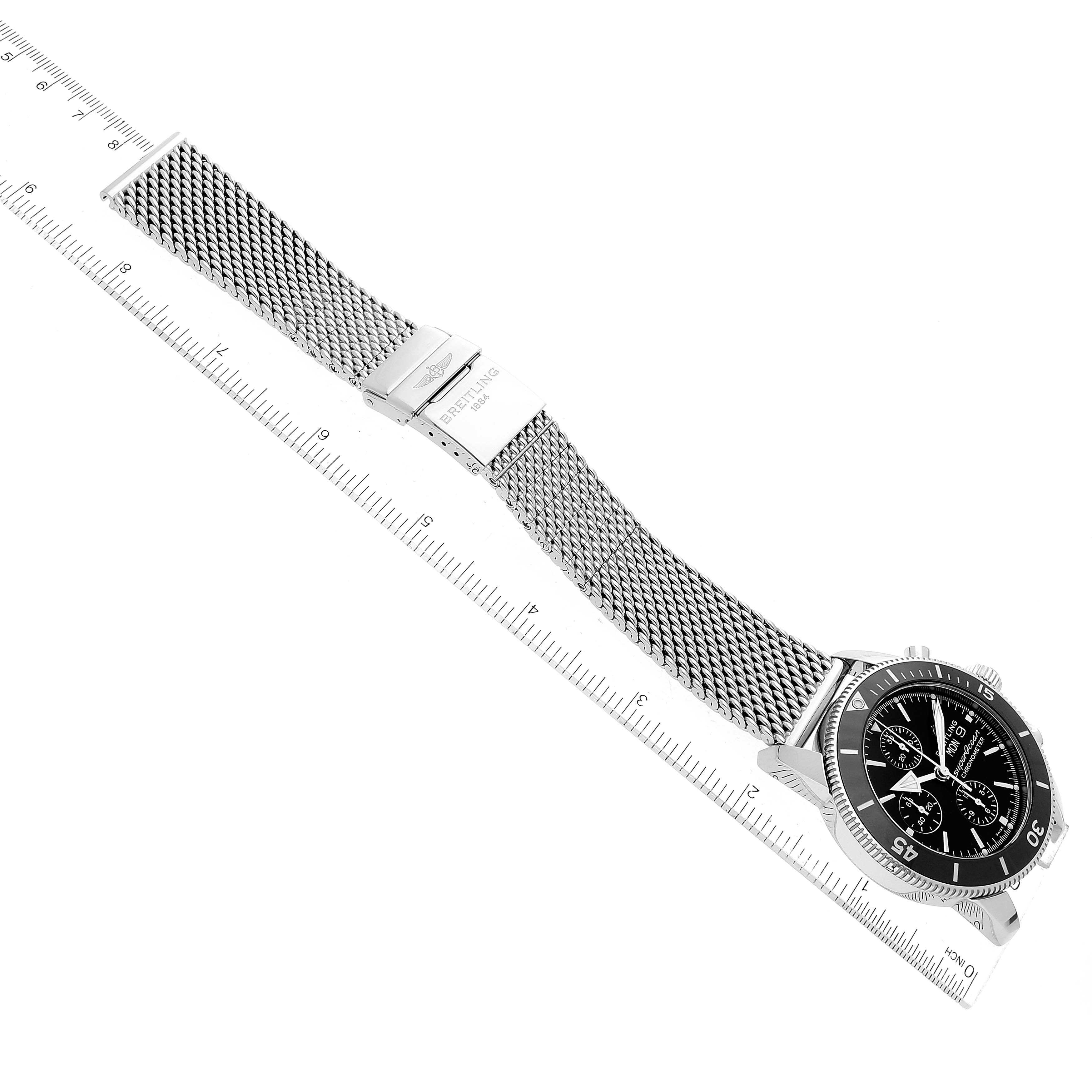 The image shows a Breitling Superocean A13320 Men's Stainless Steel Black Dial A13320 Men's Stainless Steel Black Dial watch laid flat, highlighting the black dial, bezel, mesh bracelet, and the clasp.