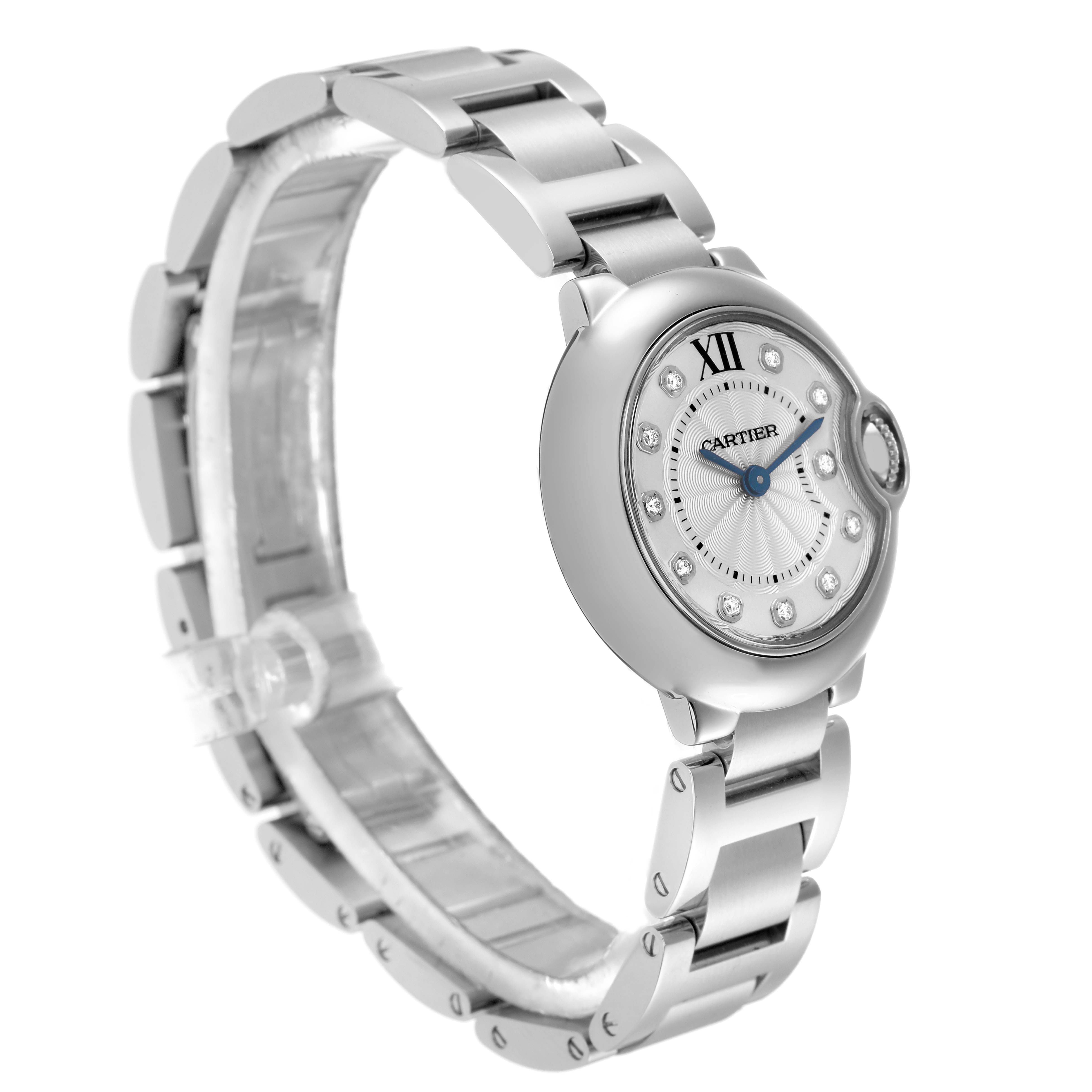 The Cartier Ballon Bleu WE902073 Women
s Stainless Steel Silver Dial WE902073 Women
s Stainless Steel Silver Dial watch is shown at a slight angle, highlighting its round face, metallic bracelet, and unique crown design.