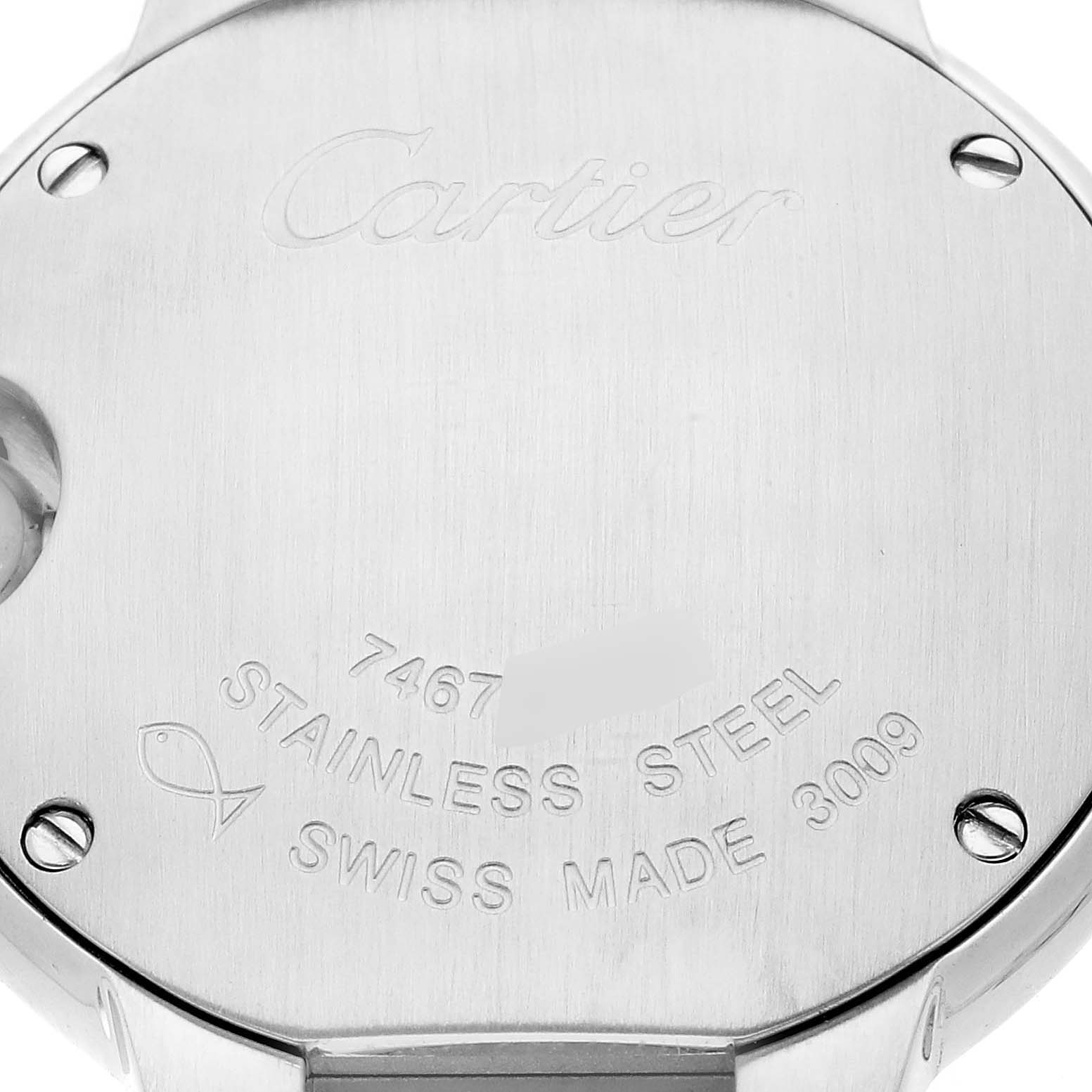 The image shows the back of a Cartier Ballon Bleu WE902073 Women
s Stainless Steel Silver Dial WE902073 Women
s Stainless Steel Silver Dial watch, featuring engravings and screws at an overhead angle.