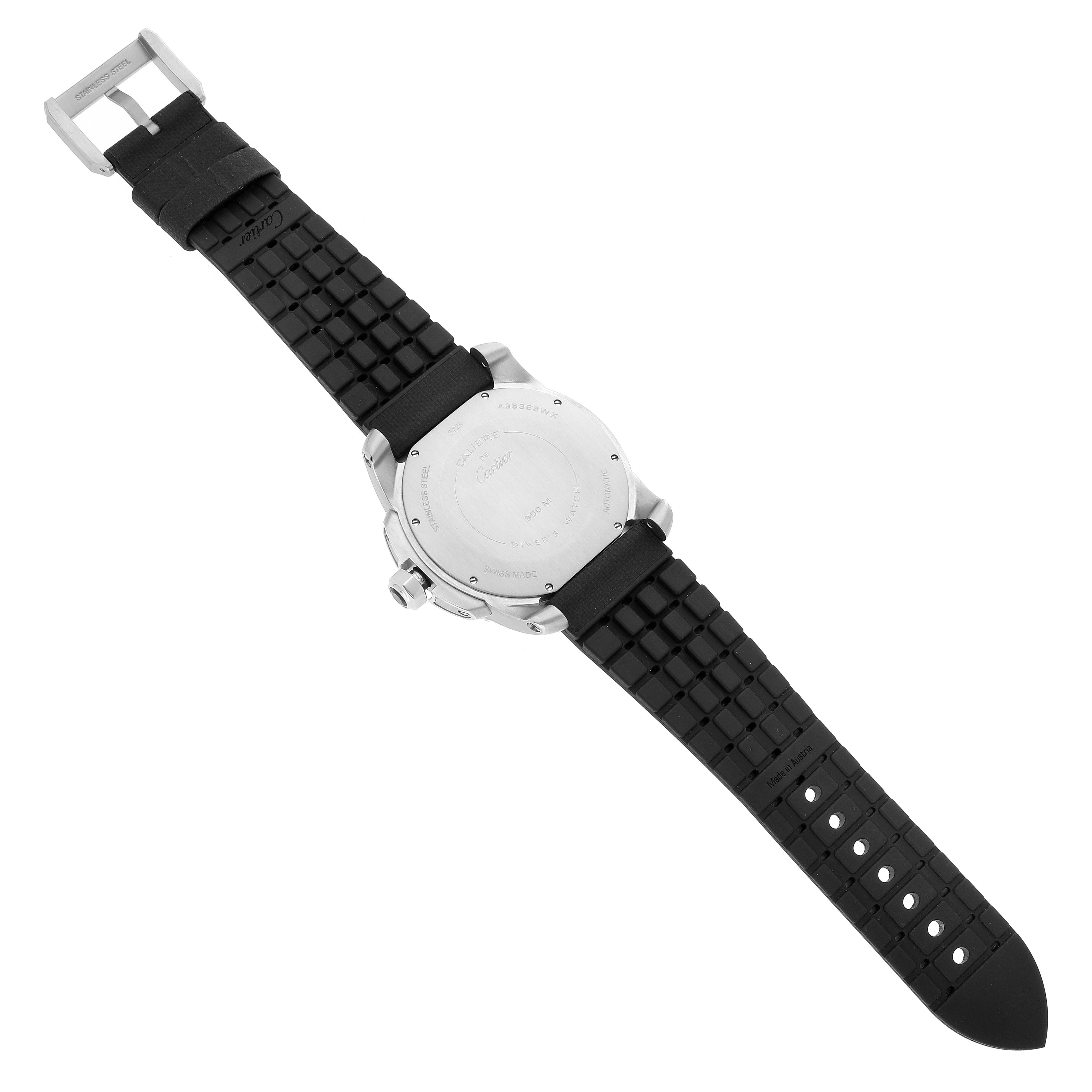 The image shows the back side of a Calibre de Cartier watch by Cartier, highlighting the case back and black strap.