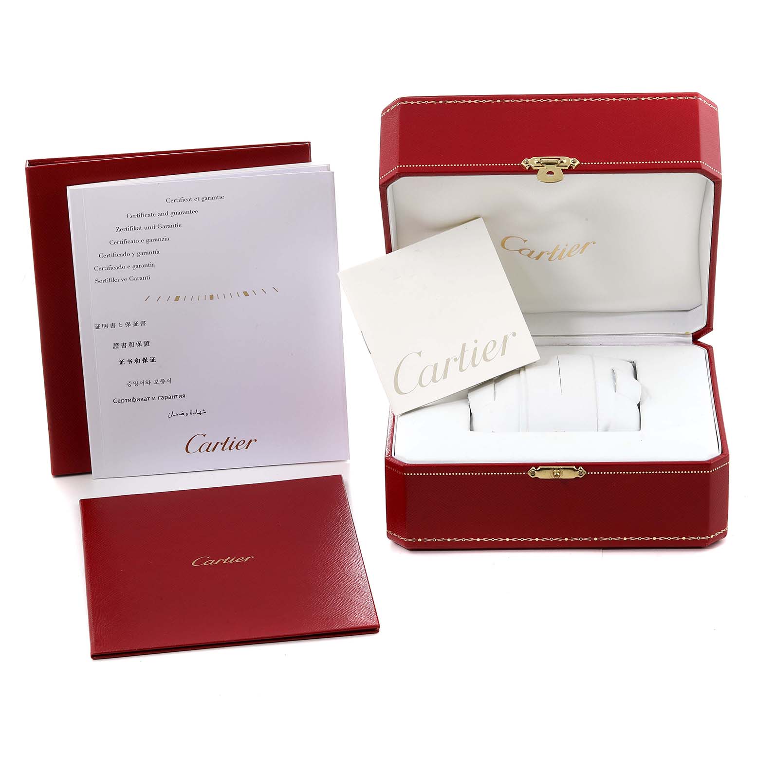 The image shows the packaging, warranty, and instruction booklets for the Calibre de Cartier watch by Cartier.