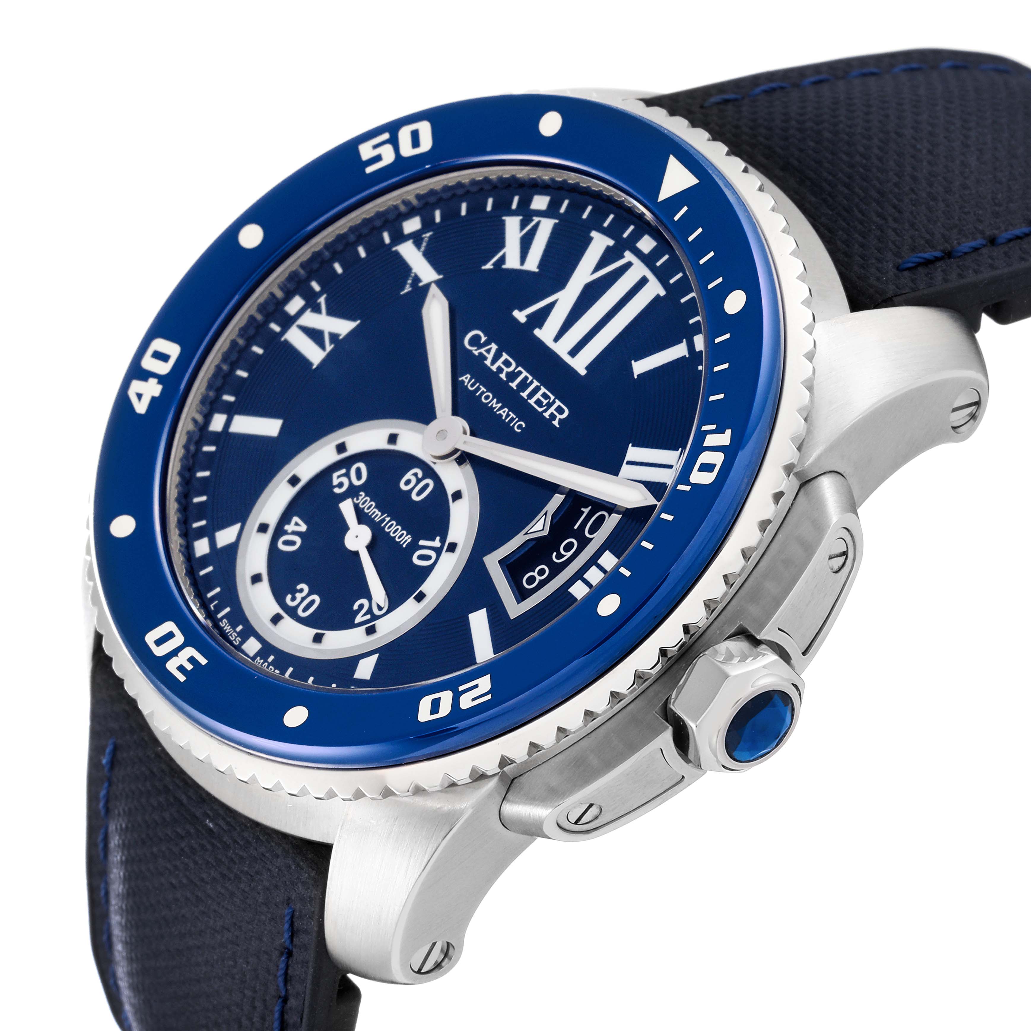 The Calibre de Cartier watch by Cartier is shown at an angle, highlighting the bezel, dial, crown, and strap.