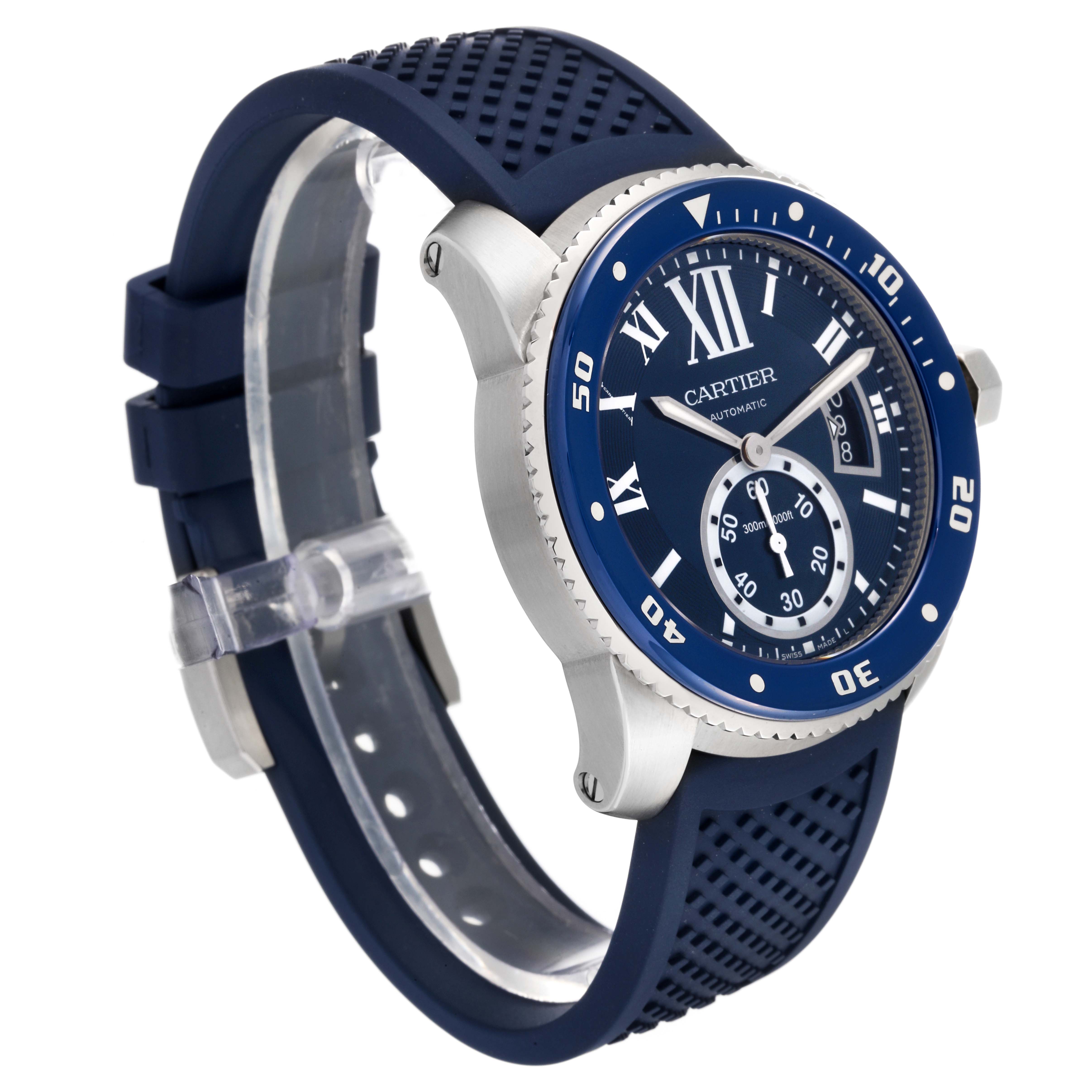 The image shows a Calibre de Cartier watch by Cartier at a side angle, highlighting its blue face, bezel, and rubber strap.