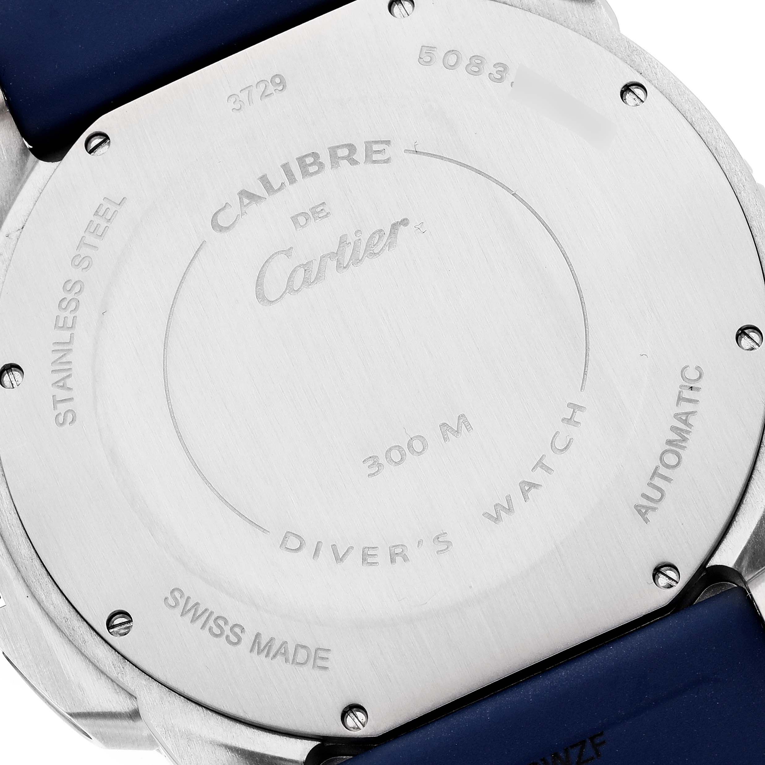 The image shows the back case of the Calibre de Cartier watch by Cartier, highlighting its inscriptions.