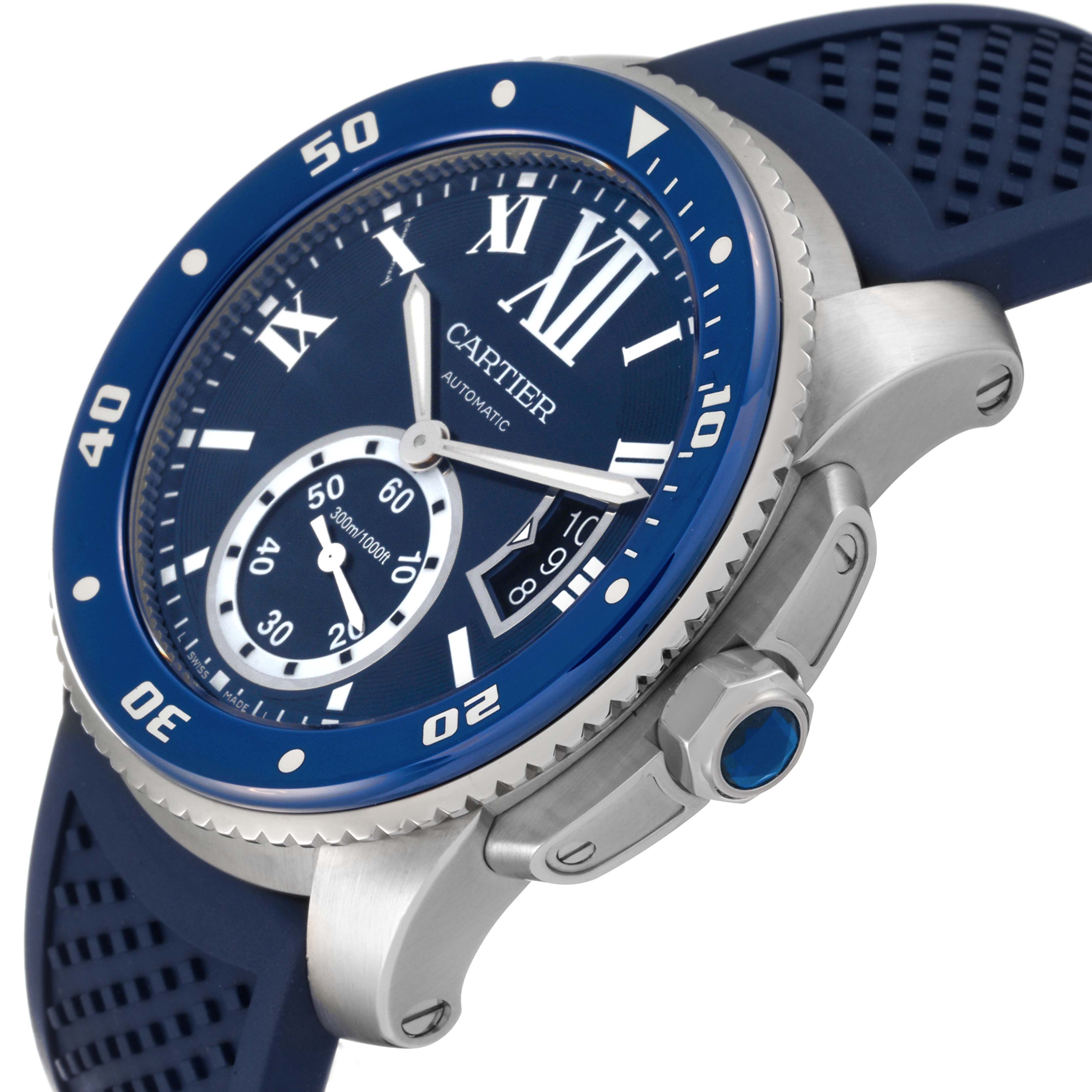 The image shows a Calibre de Cartier watch by Cartier at an oblique angle, highlighting the bezel, dial, crown, and strap.