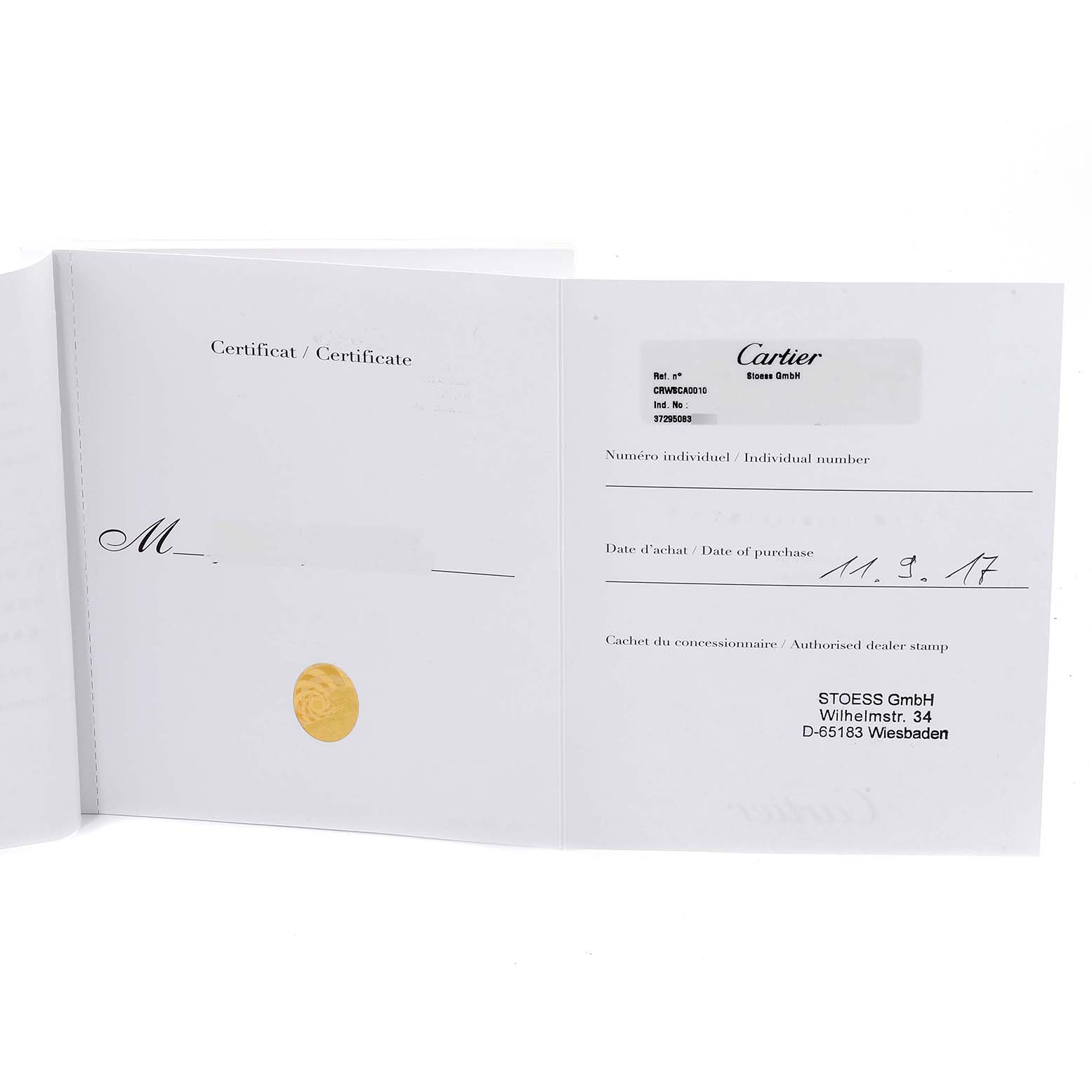 The image shows an open warranty card for the Calibre de Cartier watch by Cartier, displaying model information and purchase details.