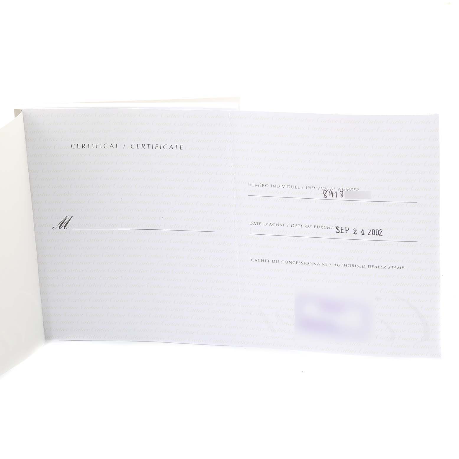 The image shows an open warranty certificate for a Cartier Roadster W62002V3 Men
s Stainless Steel Black Dial W62002V3 Men
s Stainless Steel Black Dial watch.