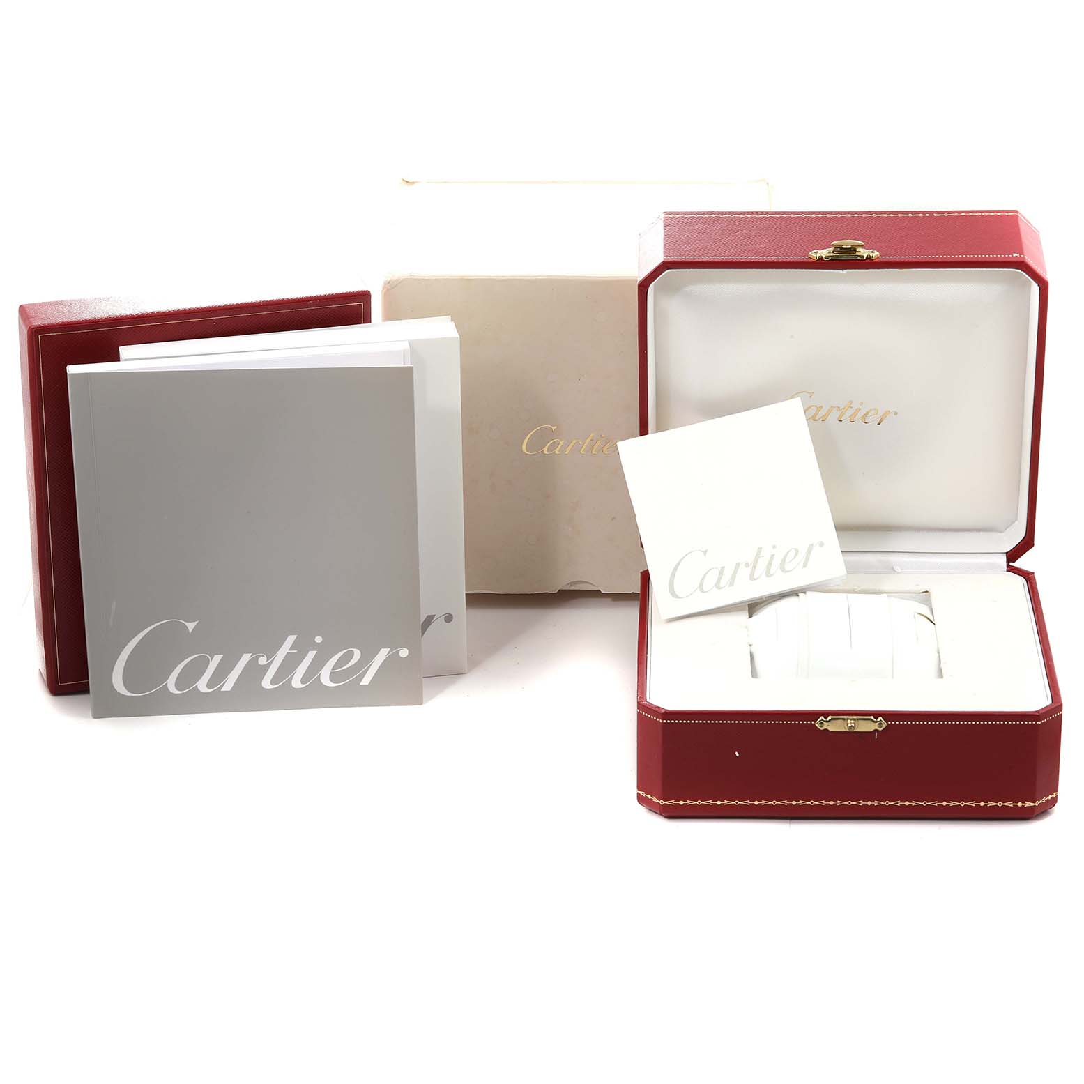 This image shows the packaging and manuals for a Santos model by Cartier, including the box, outer cardboard, and booklet.