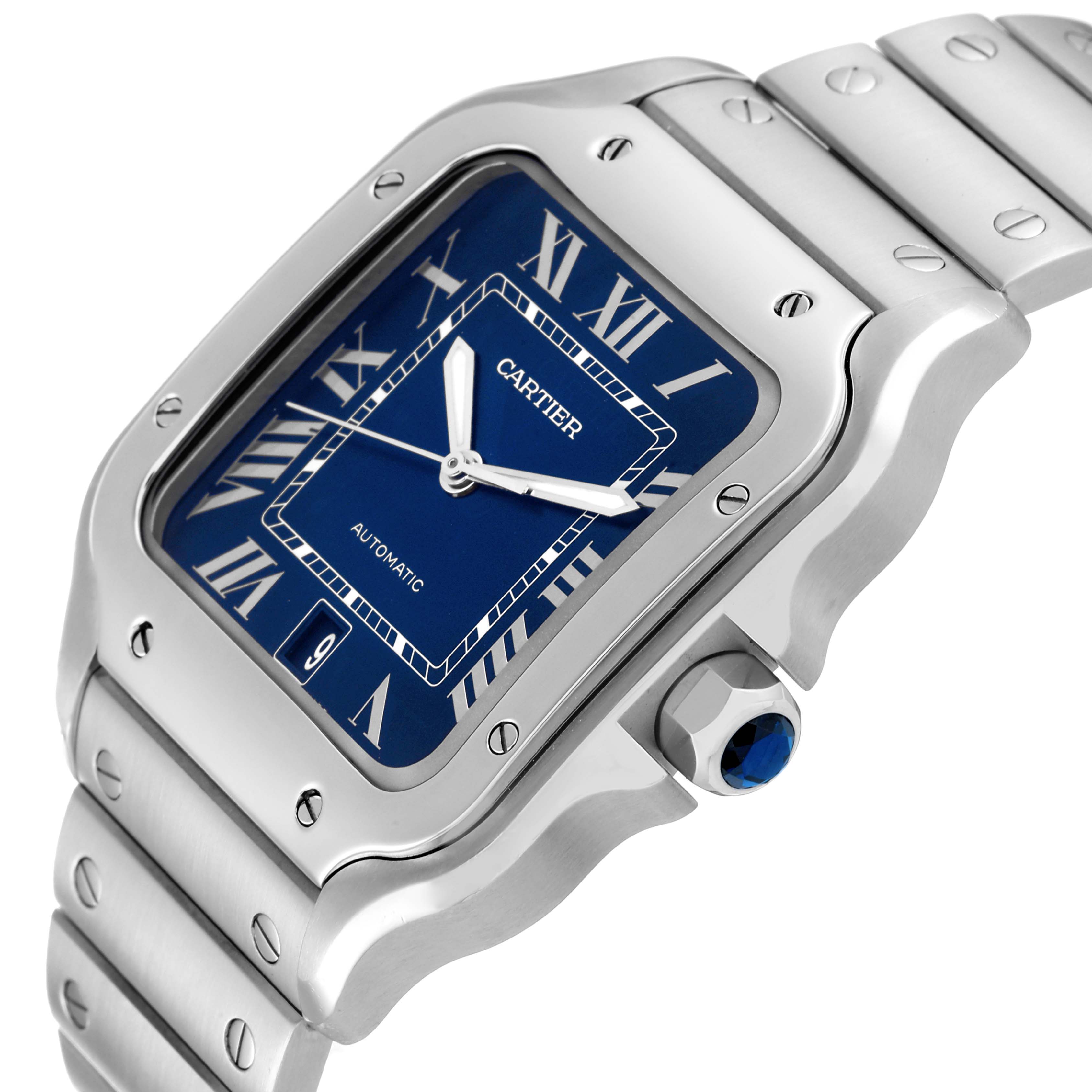 The image shows a close-up of the Cartier Santos WSSA0013 Men's Stainless Steel Blue Dial WSSA0013 Men's Stainless Steel Blue Dial watch face, crown, and part of the bracelet from a side angle.