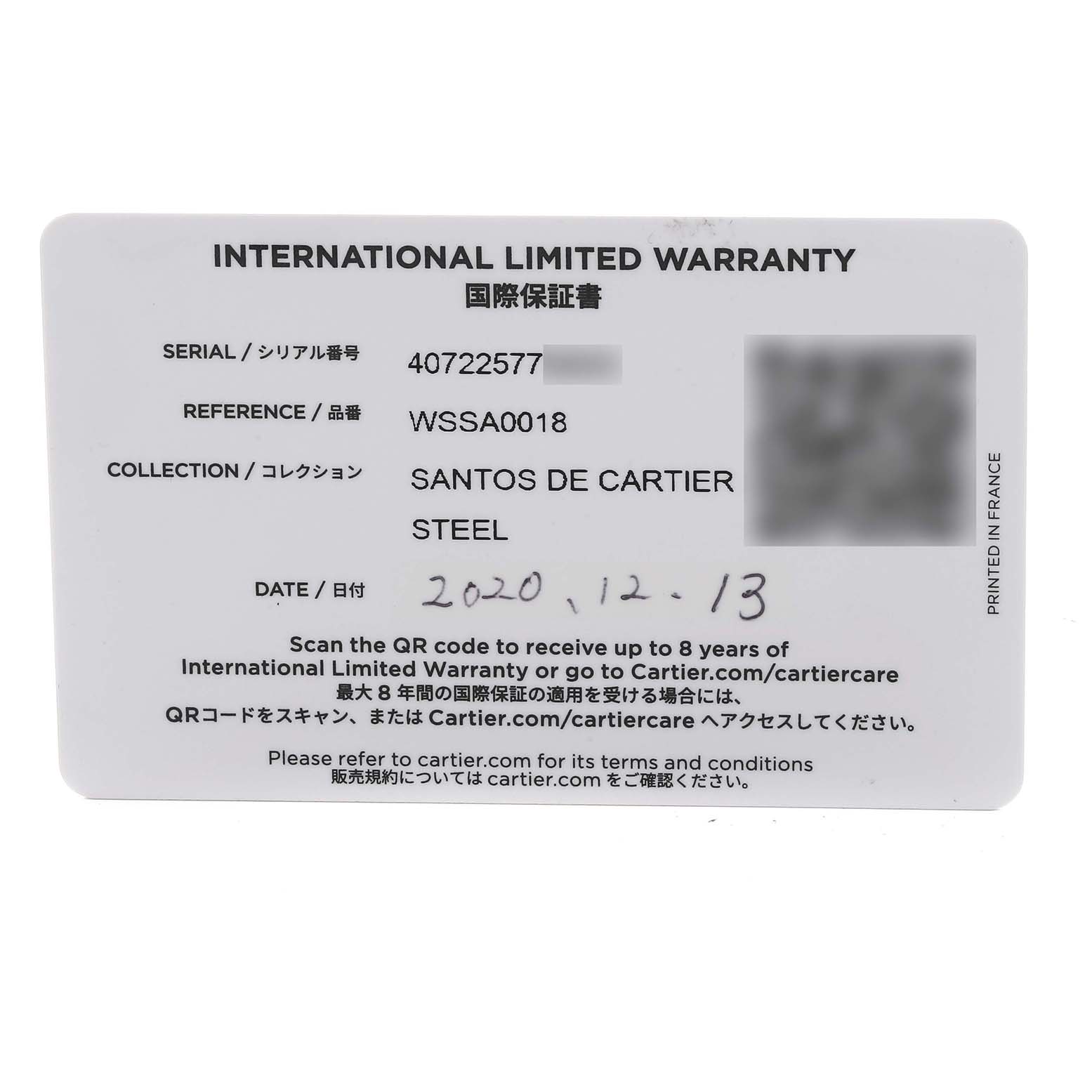 This image shows an International Limited Warranty card for the Santos de Cartier Steel model by Cartier.