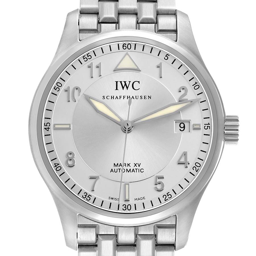 The IWC Pilot Mark XV watch is shown from a straight-on angle, highlighting the face, hands, date window, and metal bracelet.