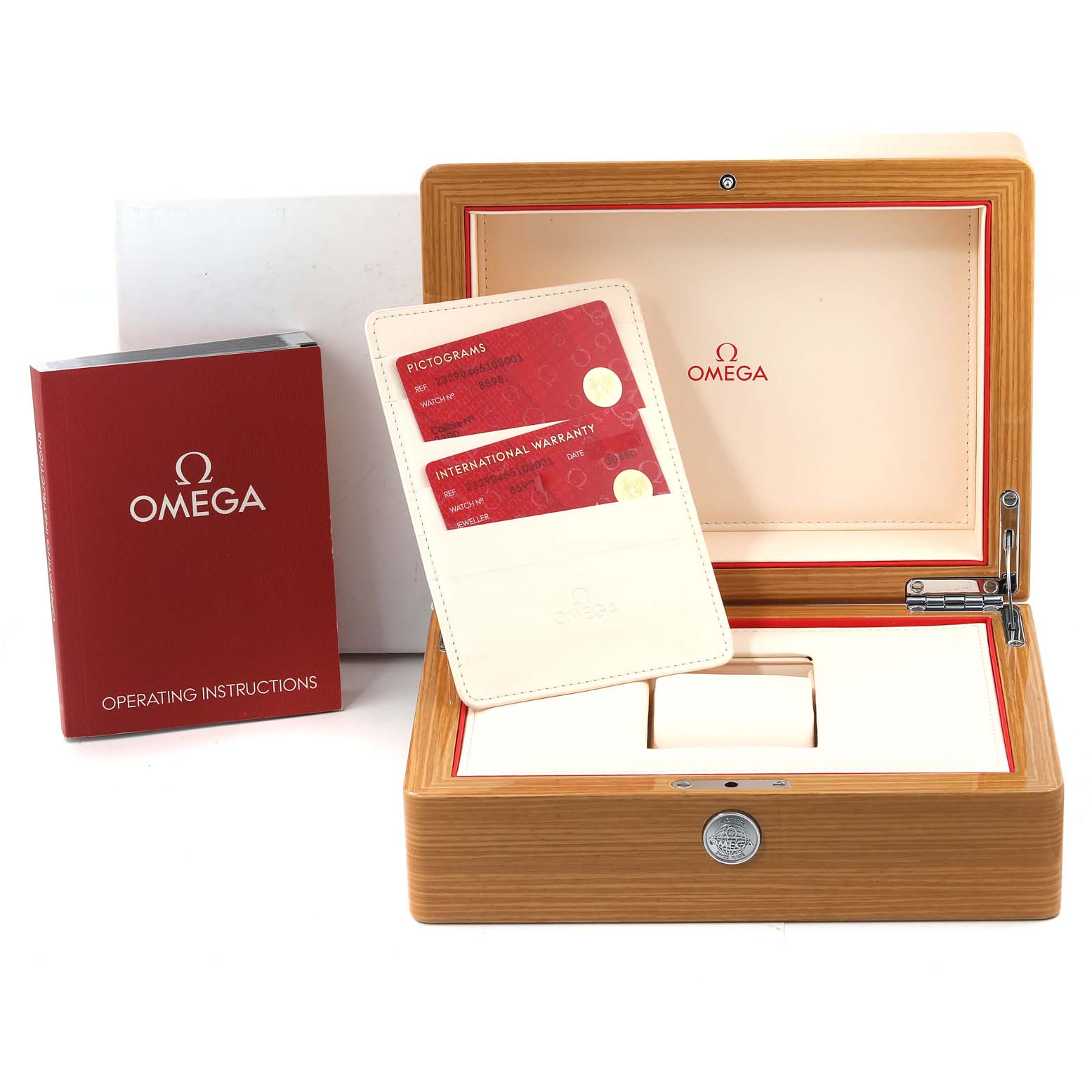 This image shows the accessories for an Omega Planet Ocean 232.90.46.51.03.001 Men
s Titanium Blue Dial 232.90.46.51.03.001 Men
s Titanium Blue Dial watch, including a wooden box, warranty cards, and an operating instructions booklet.