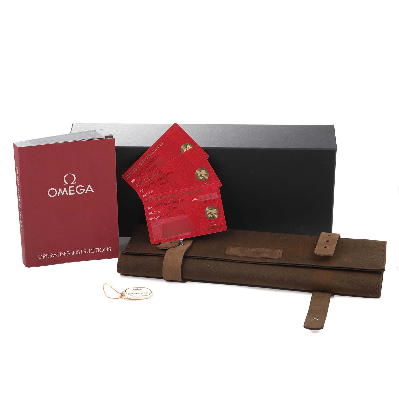 This image shows the accessories for an Omega Seamaster 210.90.42.20.01.001 Men's Titanium Brown Dial 210.90.42.20.01.001 Men's Titanium Brown Dial, including the operating instructions, warranty cards, a leather case, and a tag.