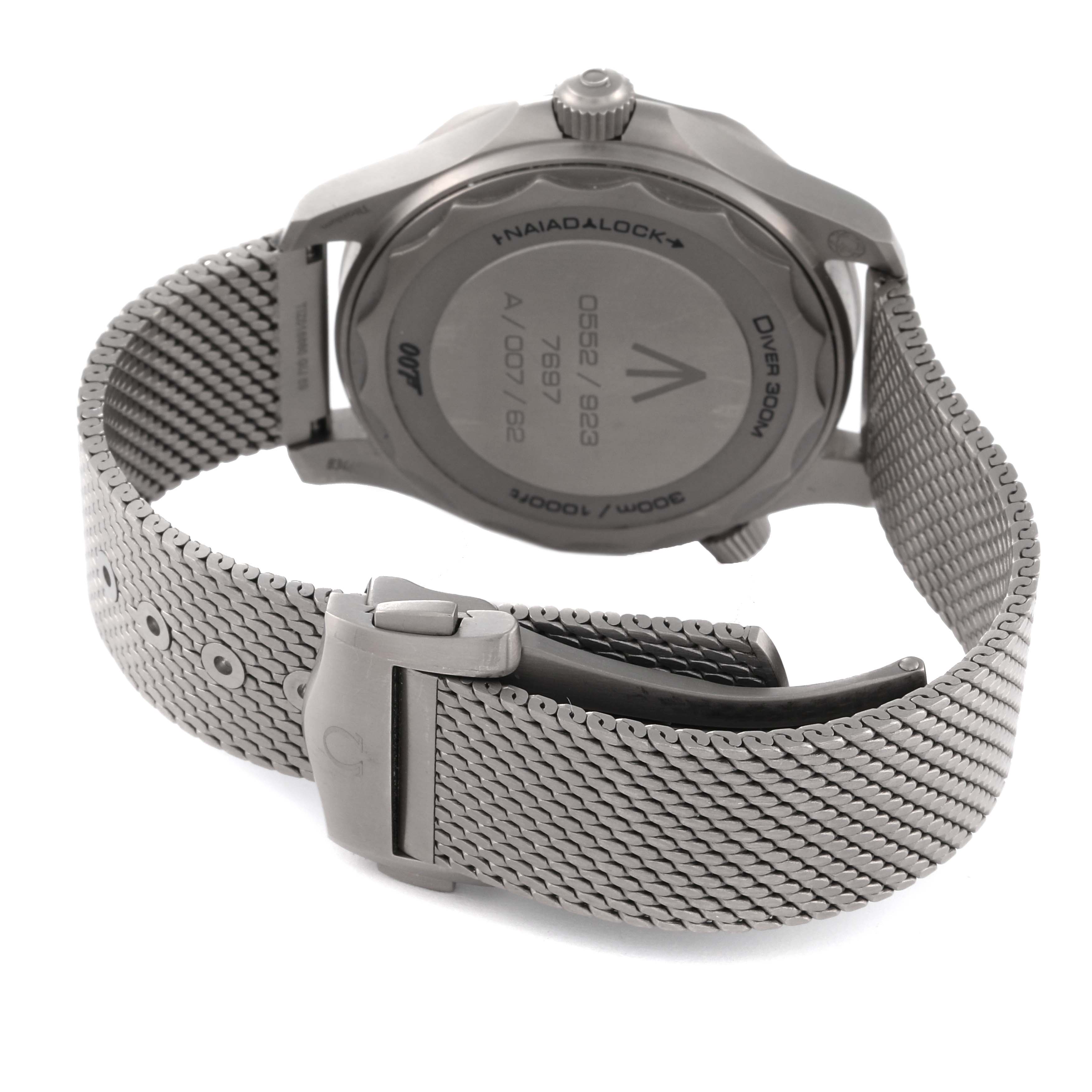 The image shows the back of an Omega Seamaster 210.90.42.20.01.001 Men's Titanium Brown Dial 210.90.42.20.01.001 Men's Titanium Brown Dial watch, highlighting the case back and metal mesh bracelet with deployant clasp.