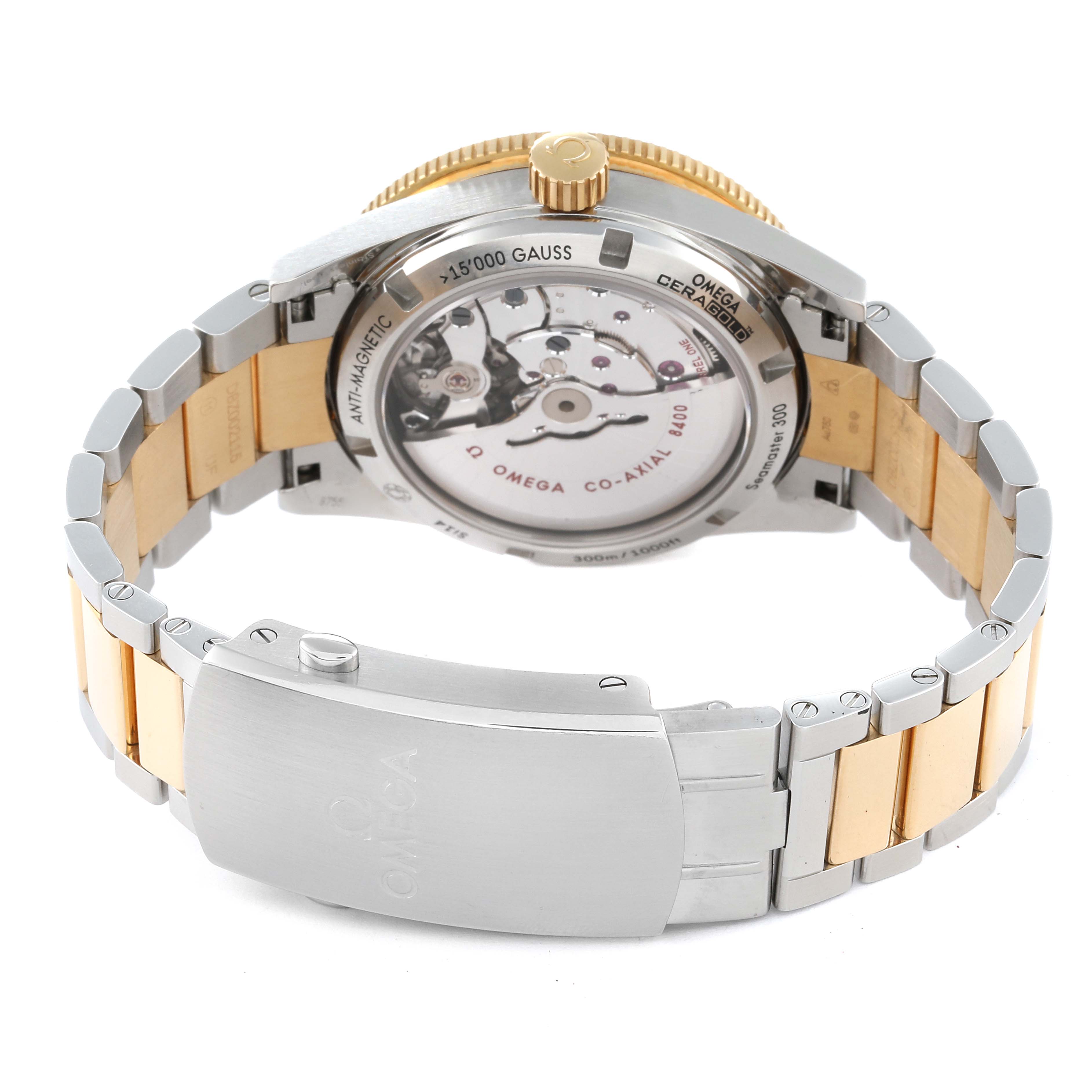 The image shows the back view of the Omega Seamaster 233.20.41.21.01.001 Men's Steel and Gold (two tone) Black Dial 233.20.41.21.01.001 Men's Steel and Gold (two tone) Black Dial watch, highlighting its movement and metal bracelet.