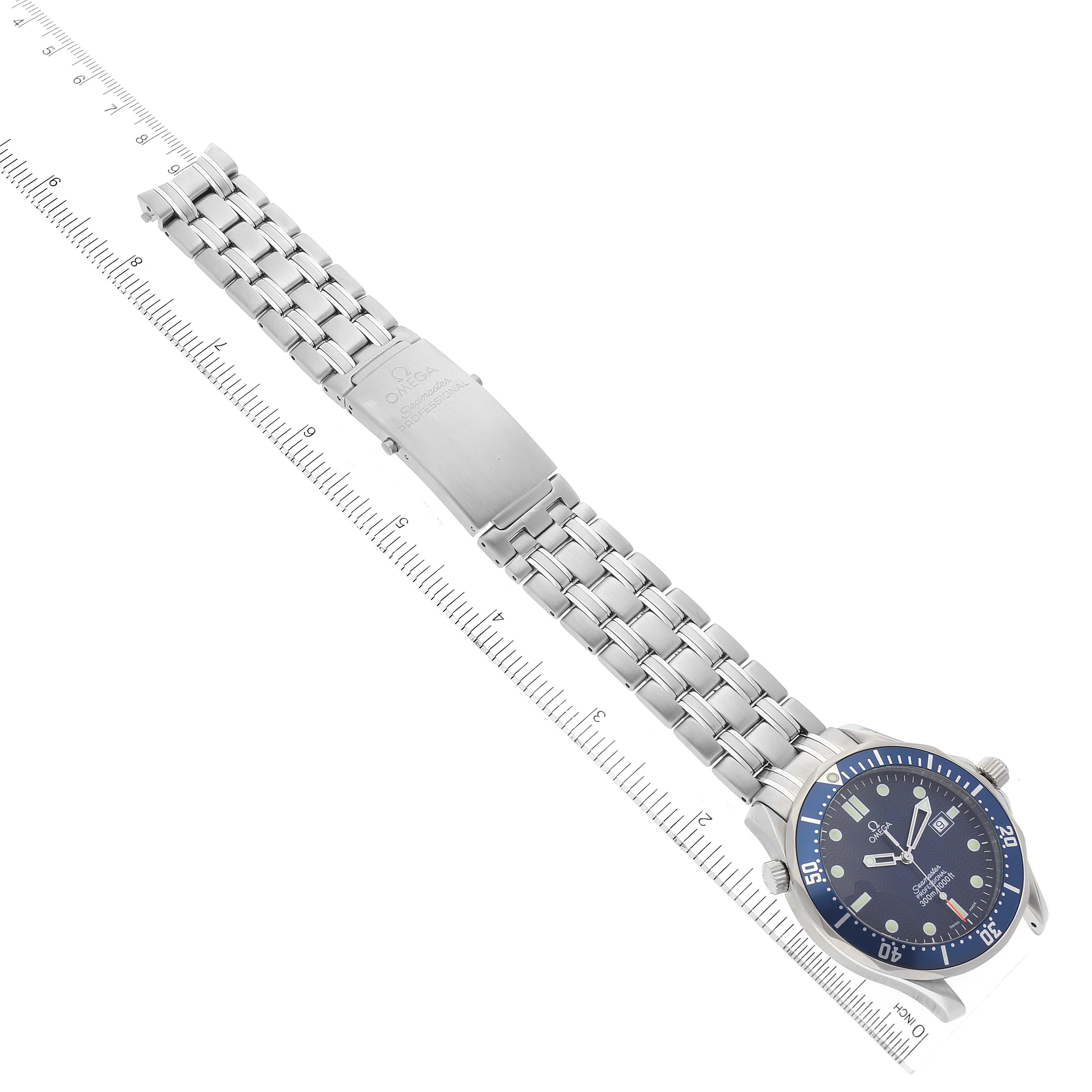 The image shows the full length of an Omega Seamaster 2541.80.00 Men's Stainless Steel Blue Dial 2541.80.00 Men's Stainless Steel Blue Dial watch laid flat from an overhead angle, alongside a ruler for scale.