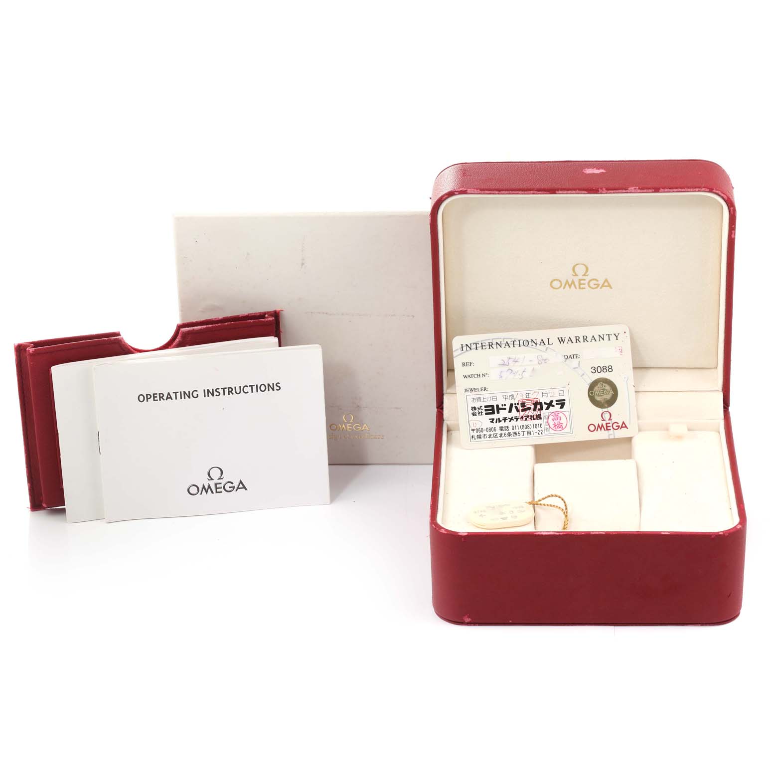 The image shows the Omega Seamaster 2541.80.00 Men's Stainless Steel Blue Dial 2541.80.00 Men's Stainless Steel Blue Dial watch accessories including an open watch box, instruction manuals, and an international warranty card.