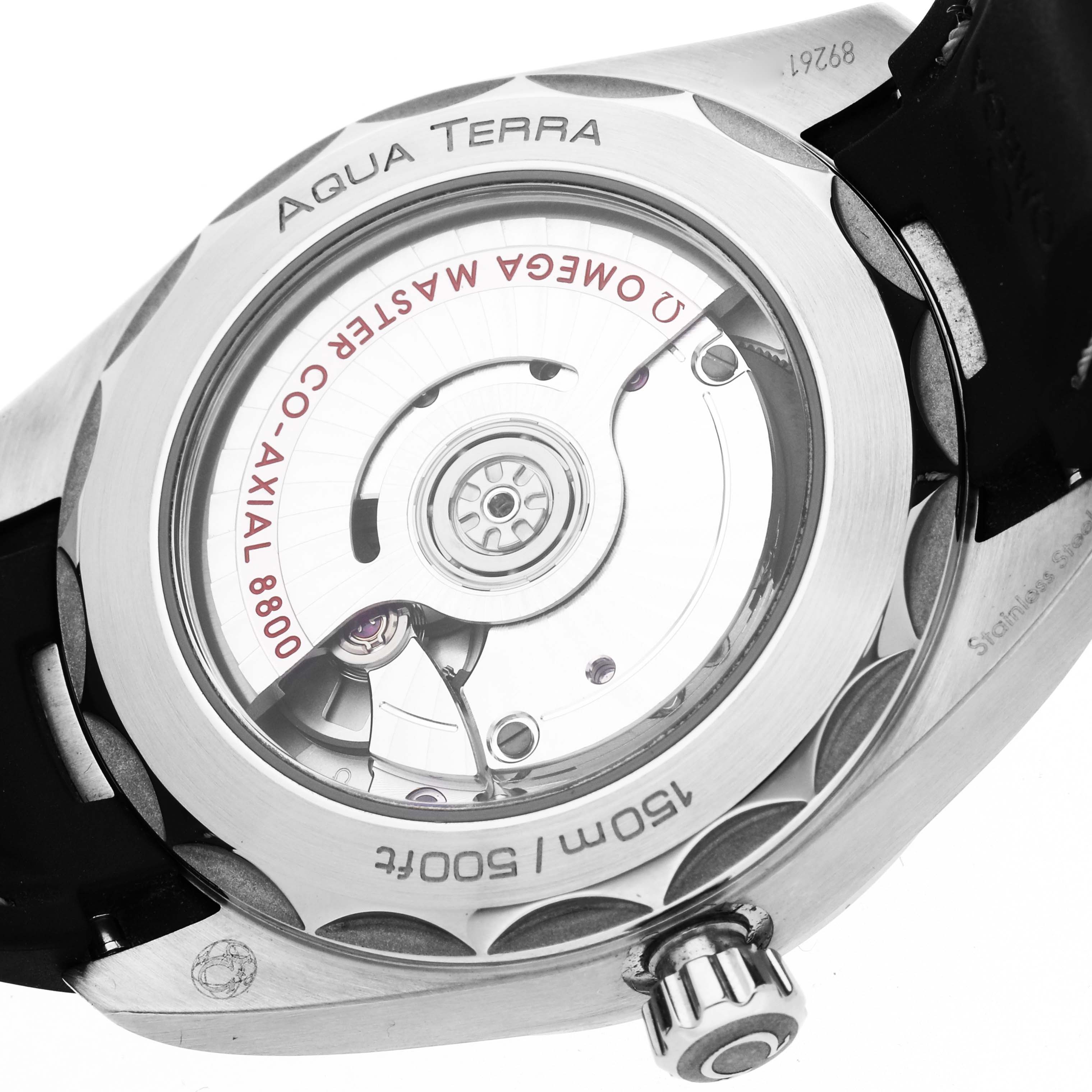 The image shows the case back of the Omega Aqua Terra 220.12.38.20.01.001 Men
s Stainless Steel Black Dial 220.12.38.20.01.001 Men
s Stainless Steel Black Dial watch, revealing its co-axial movement and crown.