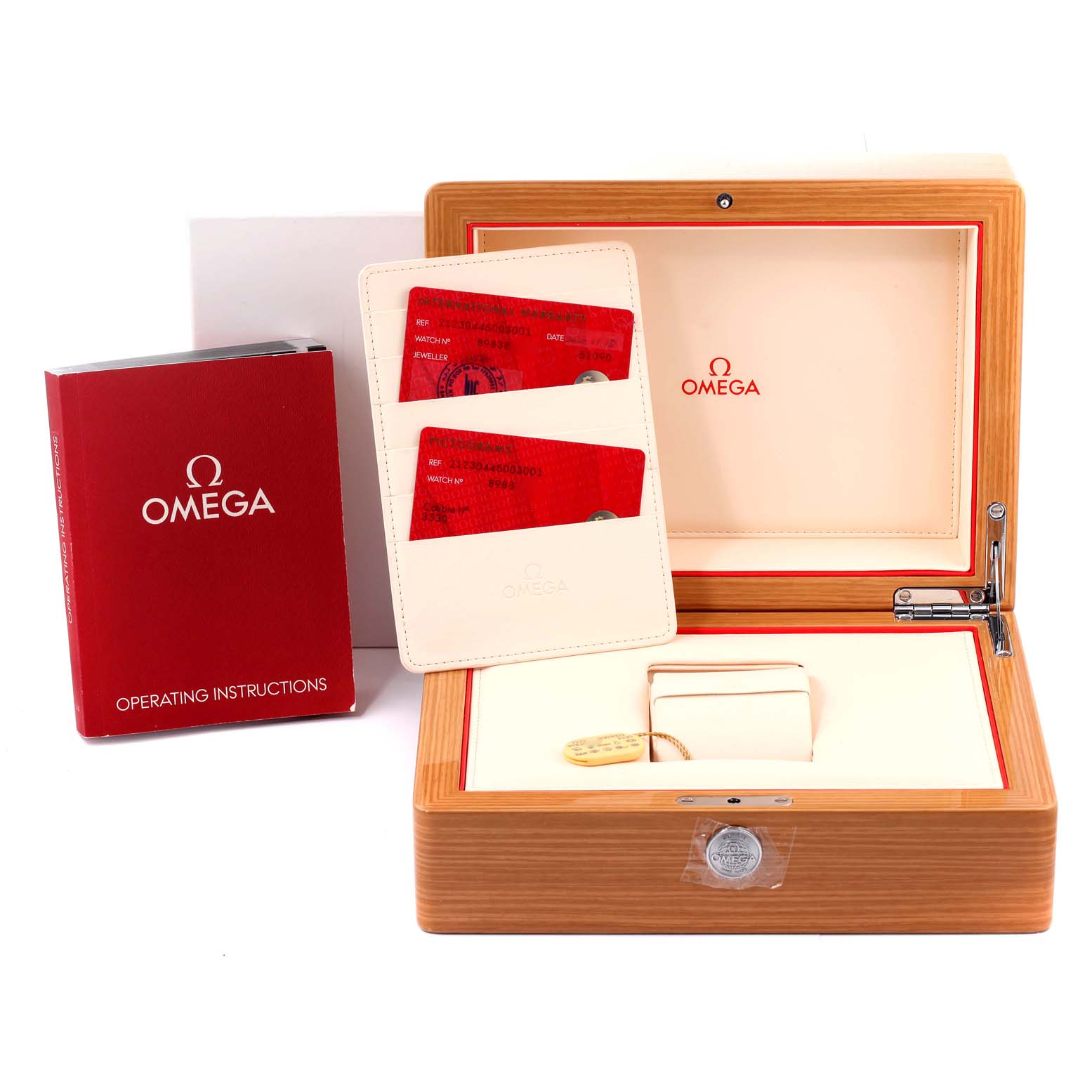 The image shows the packaging and accessories for an Omega Seamaster 212.30.44.50.03.001 Men's Stainless Steel Blue Dial 212.30.44.50.03.001 Men's Stainless Steel Blue Dial watch, including the box, operating instructions, and warranty cards.