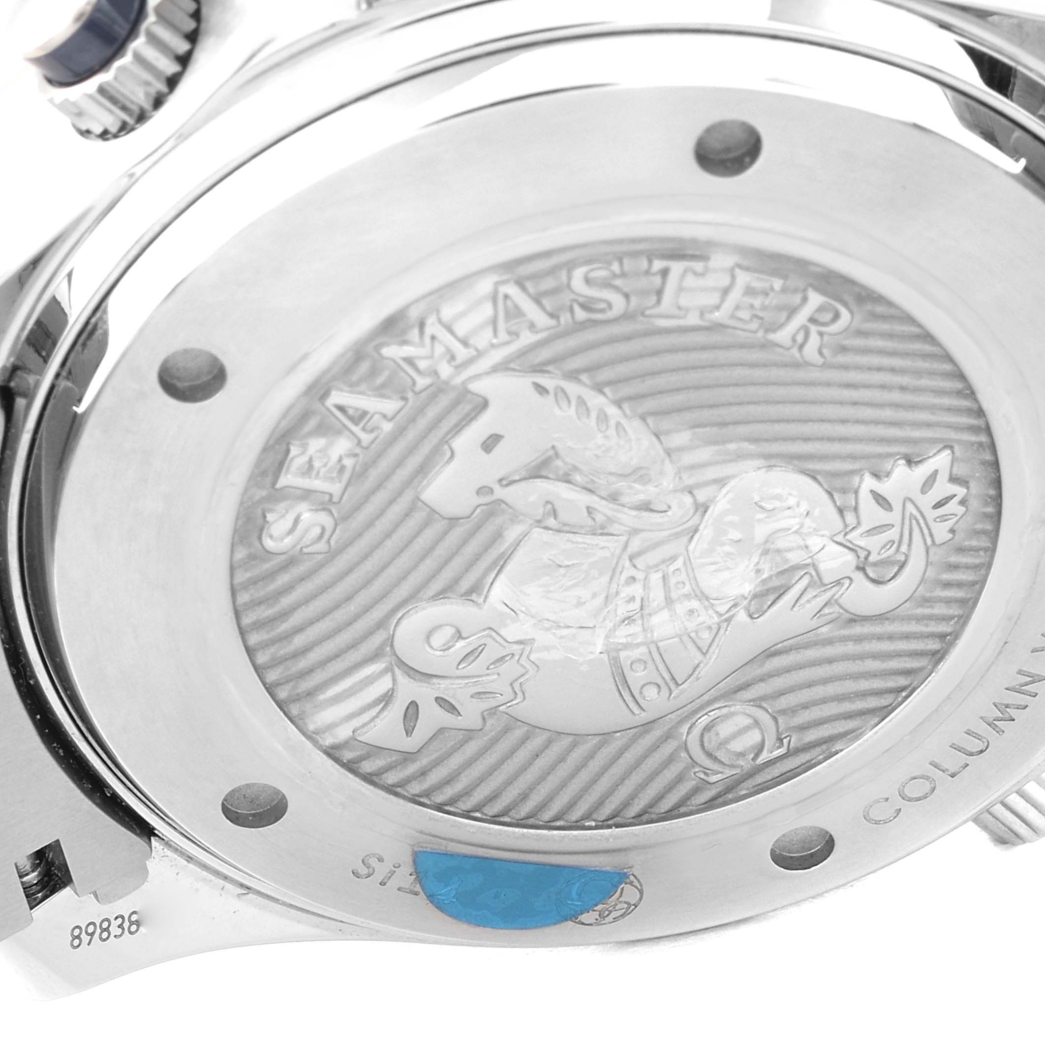 The image shows the caseback of an Omega Seamaster 212.30.44.50.03.001 Men's Stainless Steel Blue Dial 212.30.44.50.03.001 Men's Stainless Steel Blue Dial watch, highlighting the engraved design and branding.