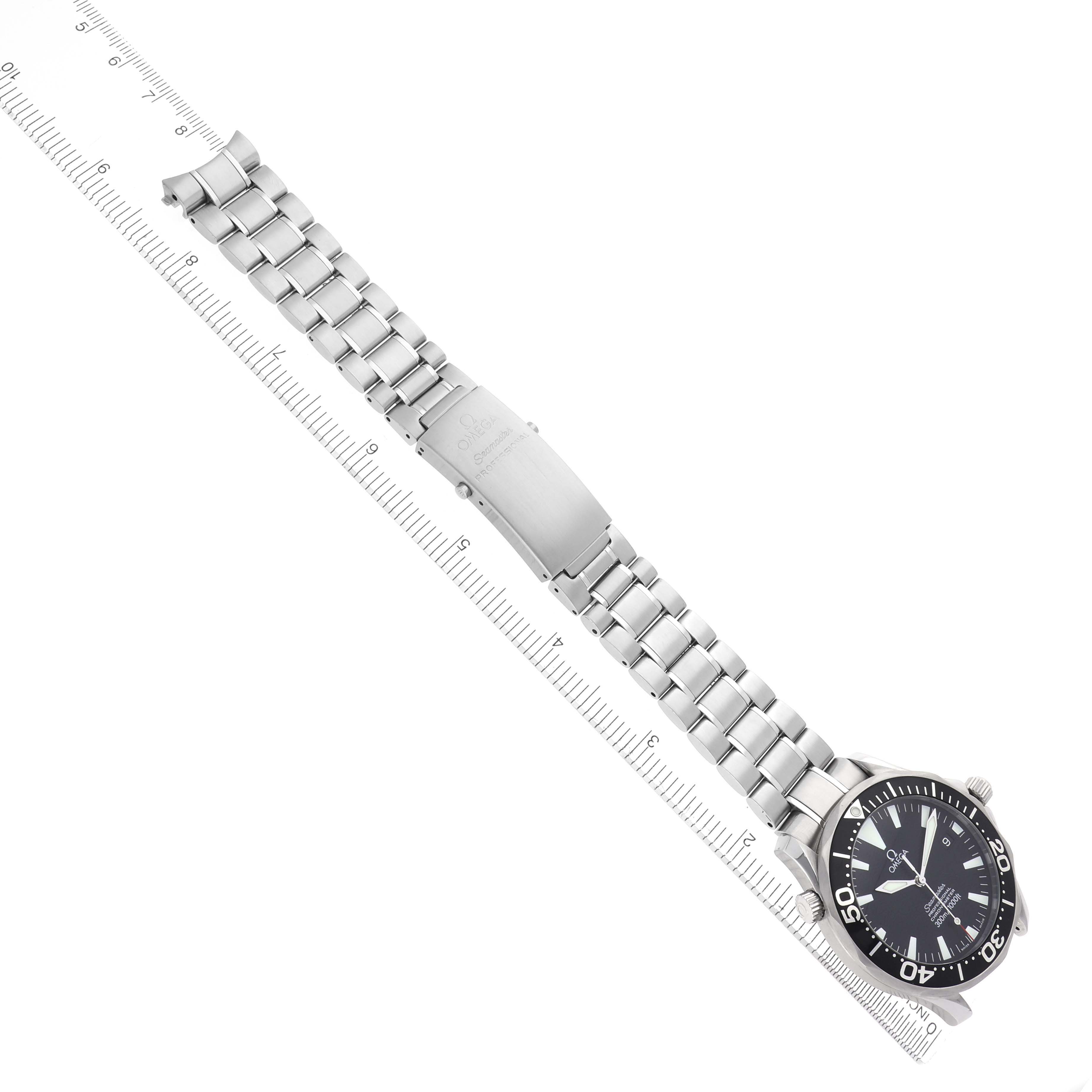 The Omega Seamaster 2254.50.00 Men
s Stainless Steel Black Dial 2254.50.00 Men
s Stainless Steel Black Dial watch is shown from an angled top-down view with a visible face, bezel, and full bracelet against a ruler.