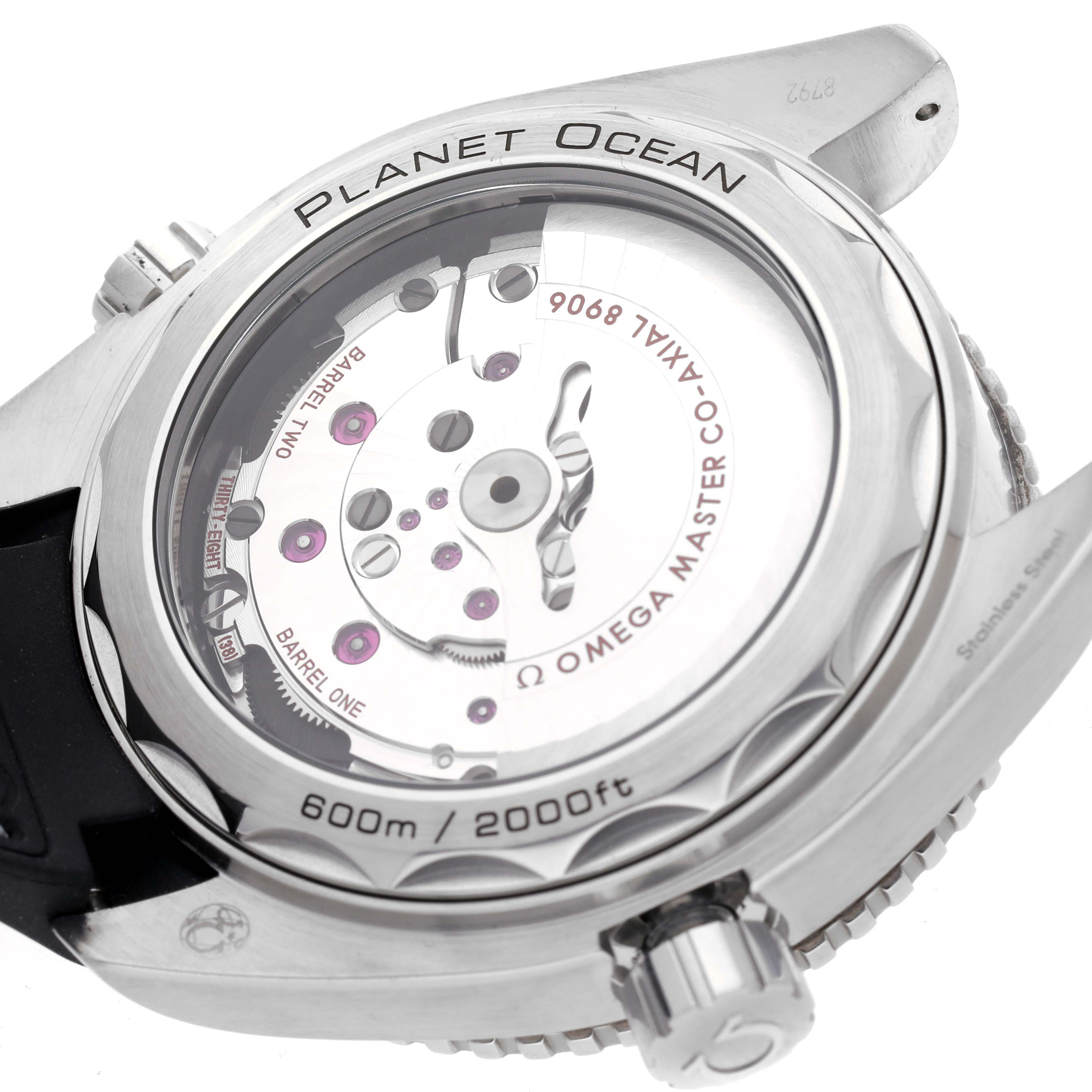 The image shows the back of the Omega Planet Ocean 215.33.44.22.01.001 Men
s Stainless Steel Black Dial 215.33.44.22.01.001 Men
s Stainless Steel Black Dial watch, displaying its movement mechanism through a transparent case back.