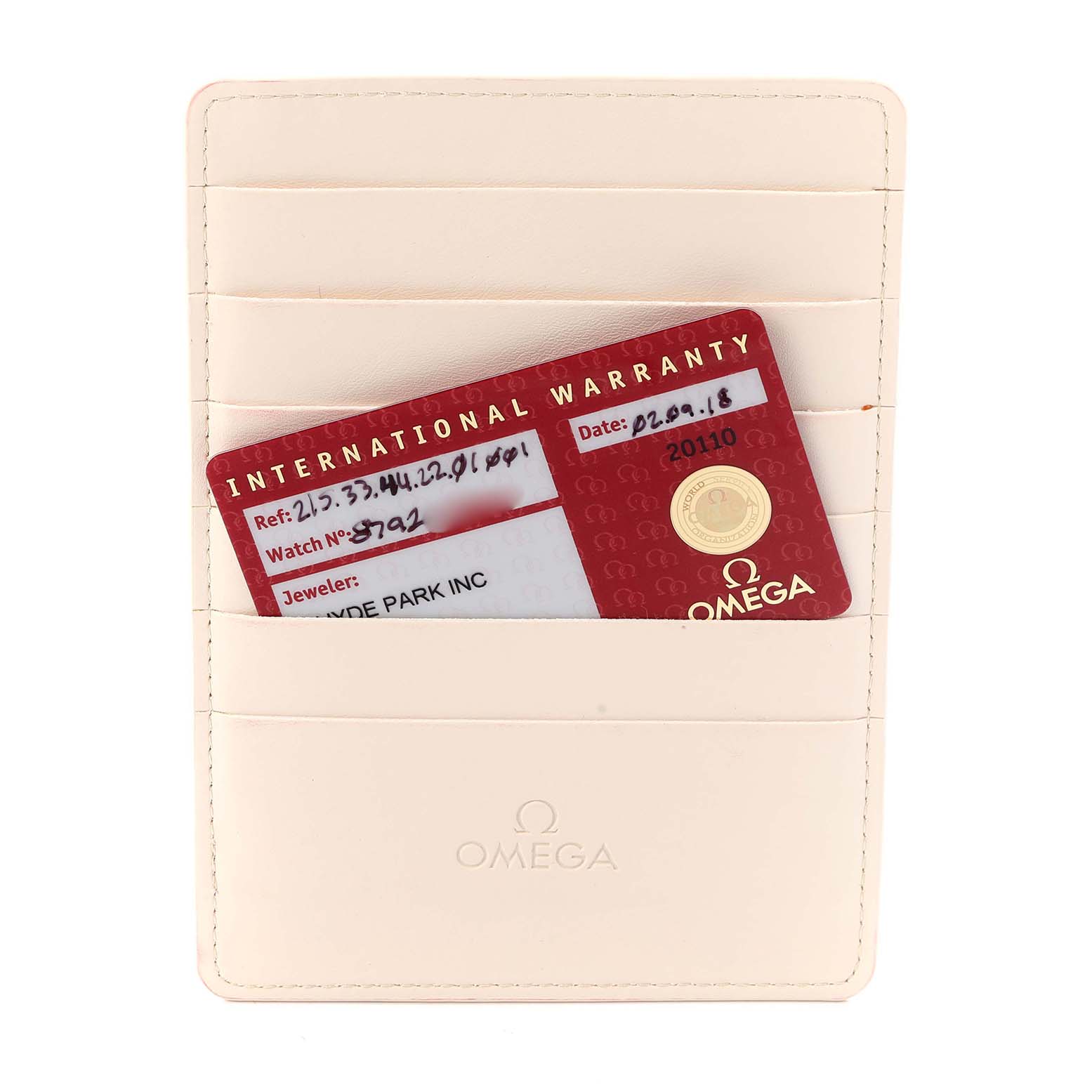 The image shows an Omega Planet Ocean 215.33.44.22.01.001 Men
s Stainless Steel Black Dial 215.33.44.22.01.001 Men
s Stainless Steel Black Dial watch
s international warranty card in a cream cardholder.