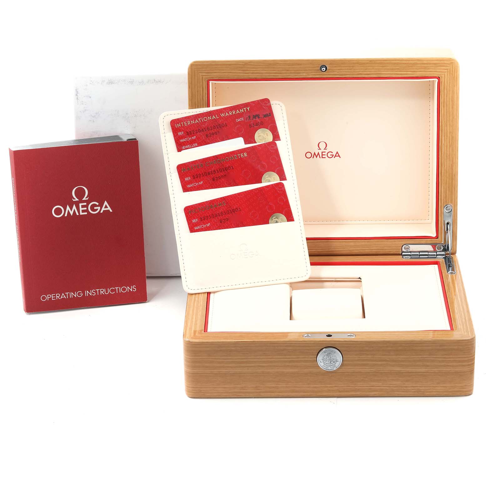 The image shows the packaging box, operating instructions, and warranty cards for an Omega Speedmaster 332.10.41.51.01.001 Men
s Stainless Steel Black Dial 332.10.41.51.01.001 Men
s Stainless Steel Black Dial watch, viewed from the top.