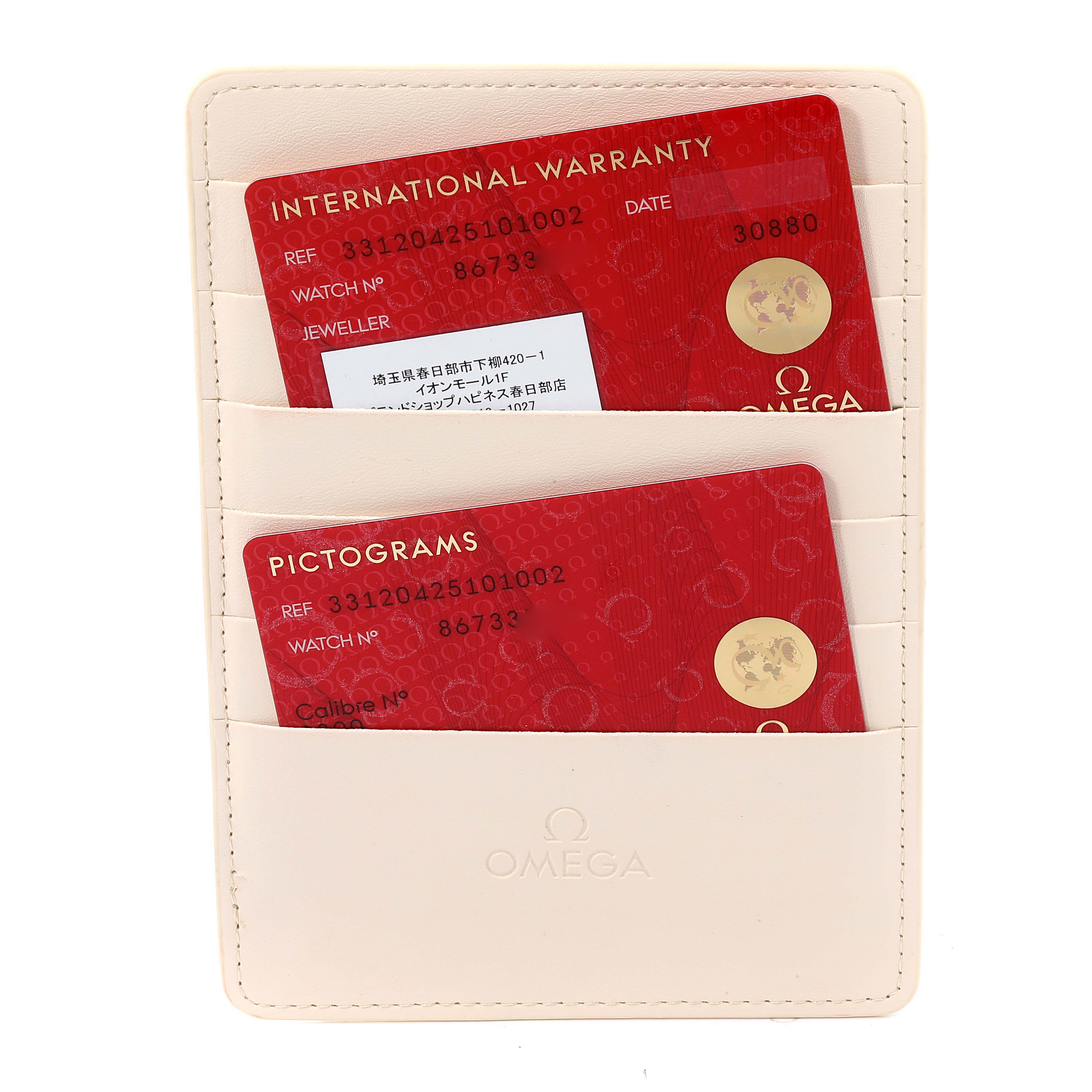 The image shows an Omega Speedmaster 331.20.42.51.01.002 Men's Steel and Gold (two tone) Black Dial 331.20.42.51.01.002 Men's Steel and Gold (two tone) Black Dial model's warranty and pictogram cards inside a beige cardholder.