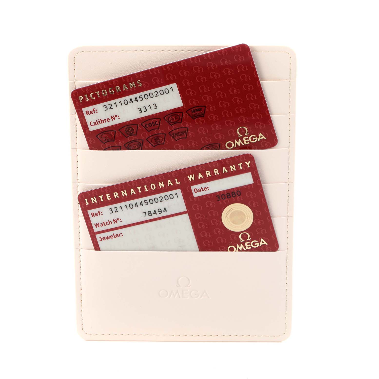 The image shows Omega Speedmaster 321.10.44.50.02.001 Men
s Stainless Steel Silver Dial 321.10.44.50.02.001 Men
s Stainless Steel Silver Dial model warranty and pictogram cards in a cream cardholder.