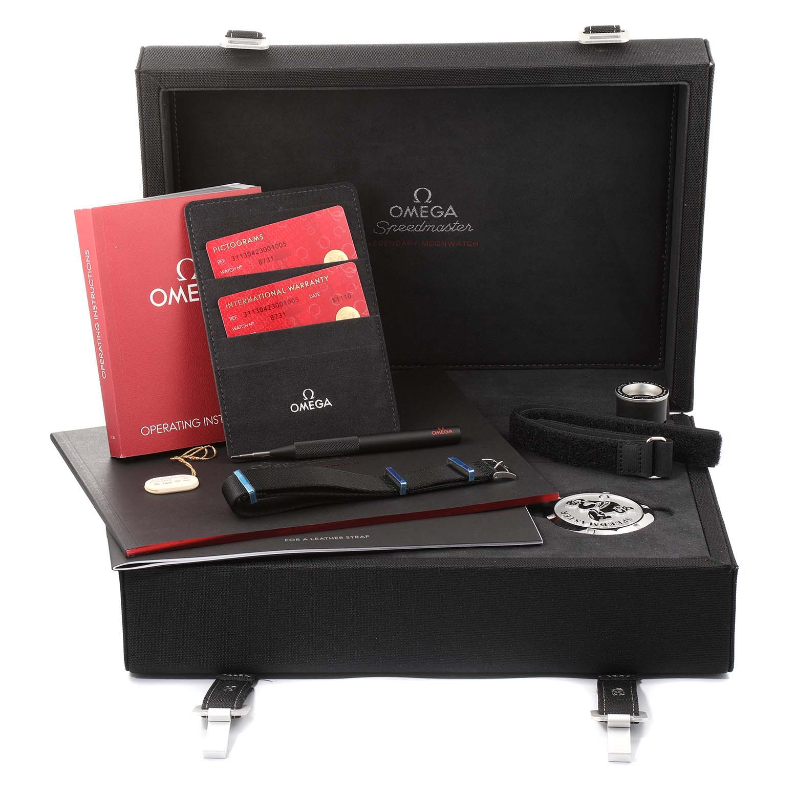 The image shows a complete set of Omega Speedmaster 311.30.42.30.01.005 Men
s Stainless Steel Black Dial 311.30.42.30.01.005 Men
s Stainless Steel Black Dial watch accessories, including manuals, warranty cards, a strap, and tools.