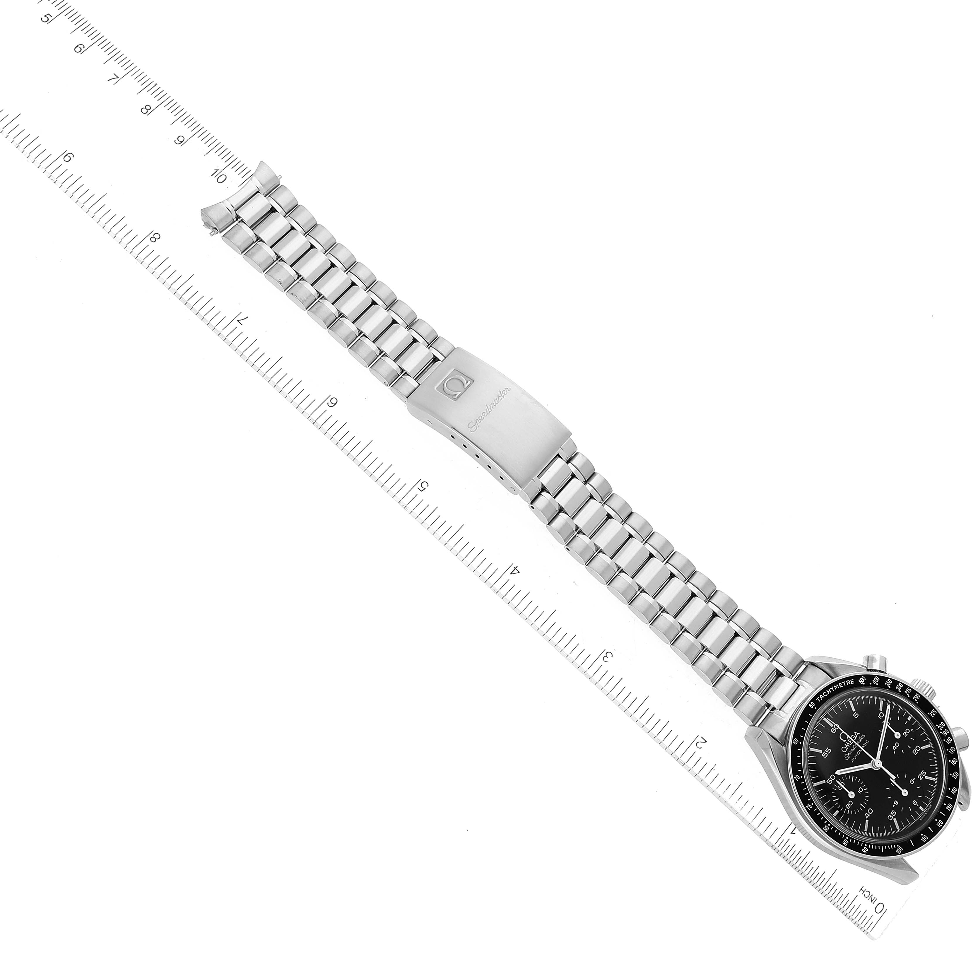 The image shows an Omega Speedmaster 3510.50.00 Men
s Stainless Steel Black Dial 3510.50.00 Men
s Stainless Steel Black Dial watch laid flat with a stainless steel bracelet and clasp, displaying the front dial and band against a ruler for scale.