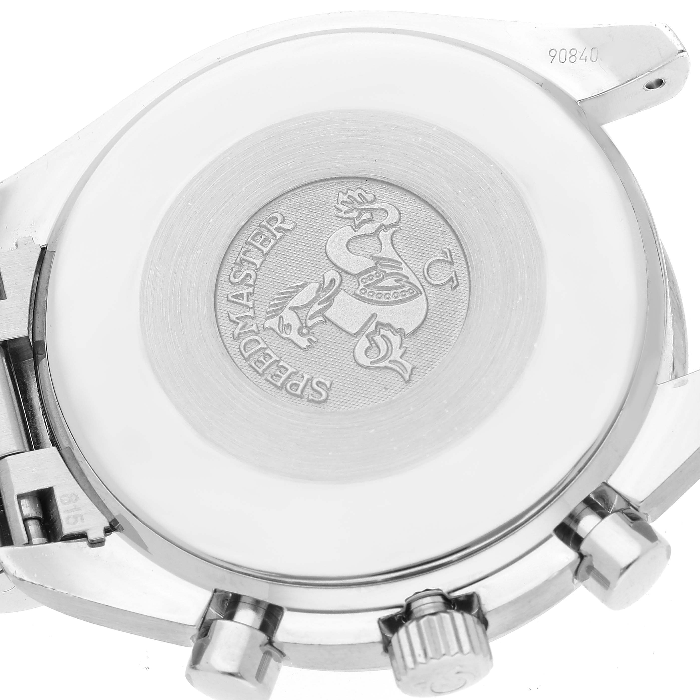 The image shows the backside of the Omega Speedmaster 3539.50.00 Men
s Stainless Steel Black Dial 3539.50.00 Men
s Stainless Steel Black Dial watch, with visible engravings and parts of the watch
s case and pushers.