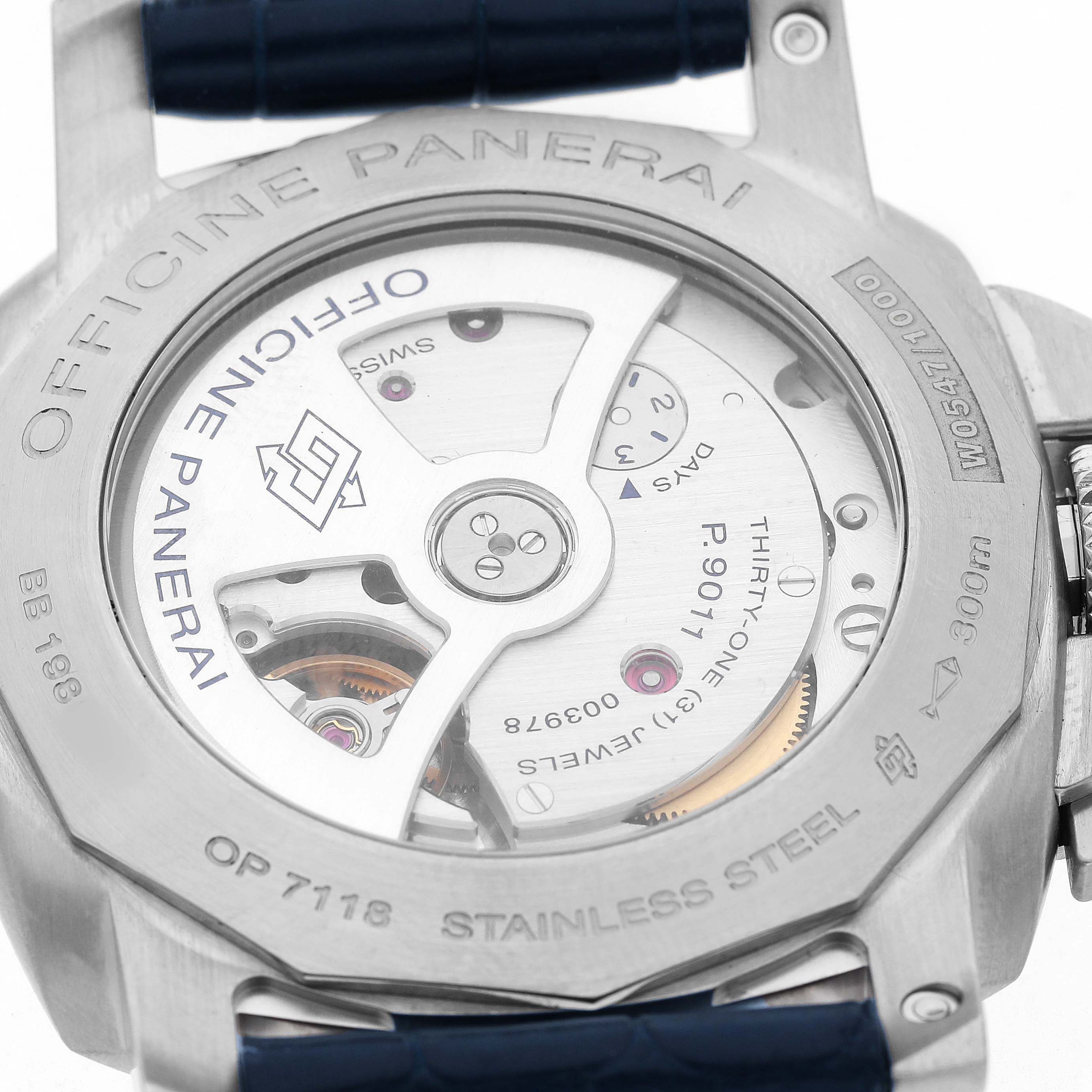 The image shows the back of a Panerai Luminor PAM01033 Men's Stainless Steel Blue Dial watch, displaying its movement and engravings.