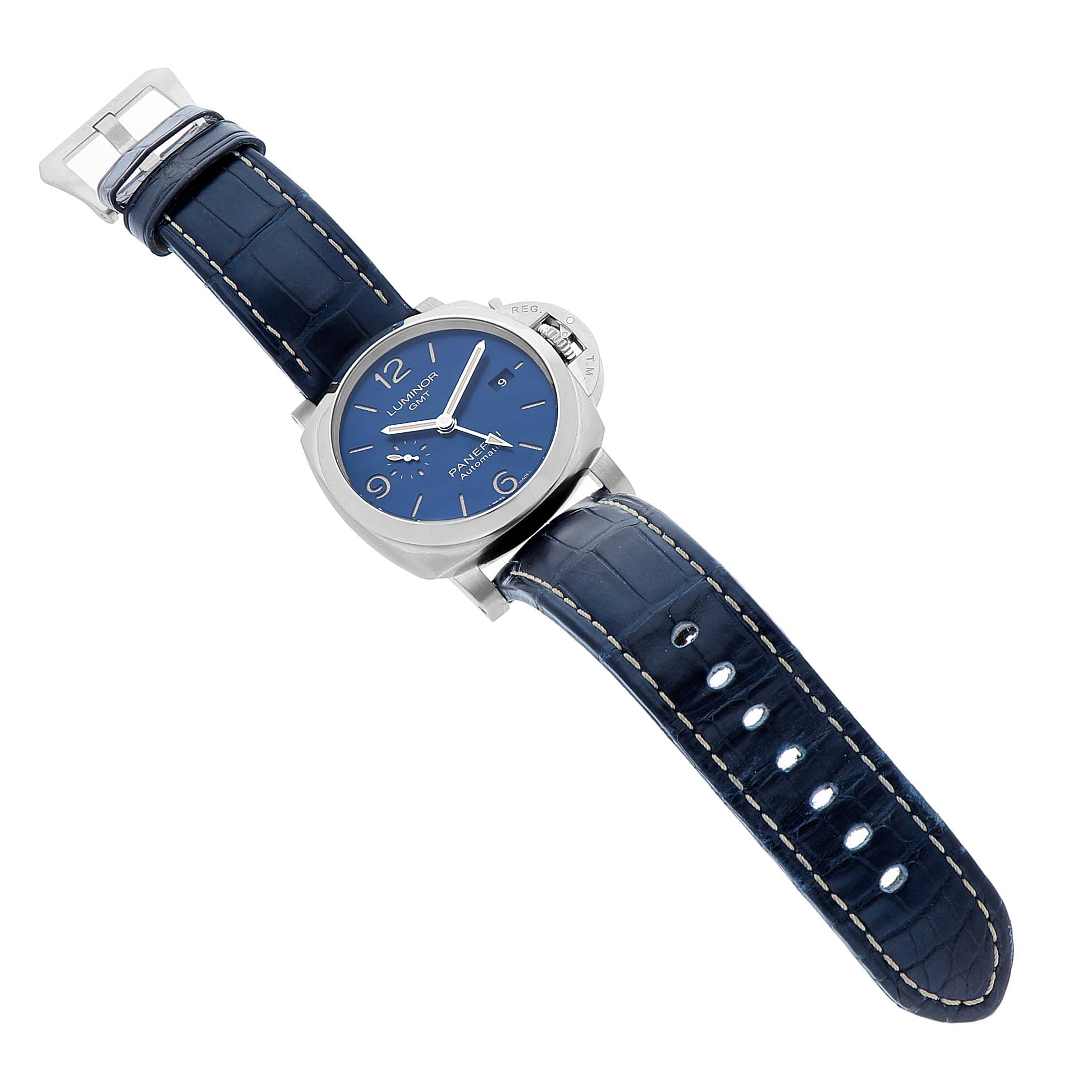 The Panerai Luminor PAM01033 Men's Stainless Steel Blue Dial watch is shown at an oblique angle, highlighting its blue dial, case, and dark blue leather strap with a buckle.