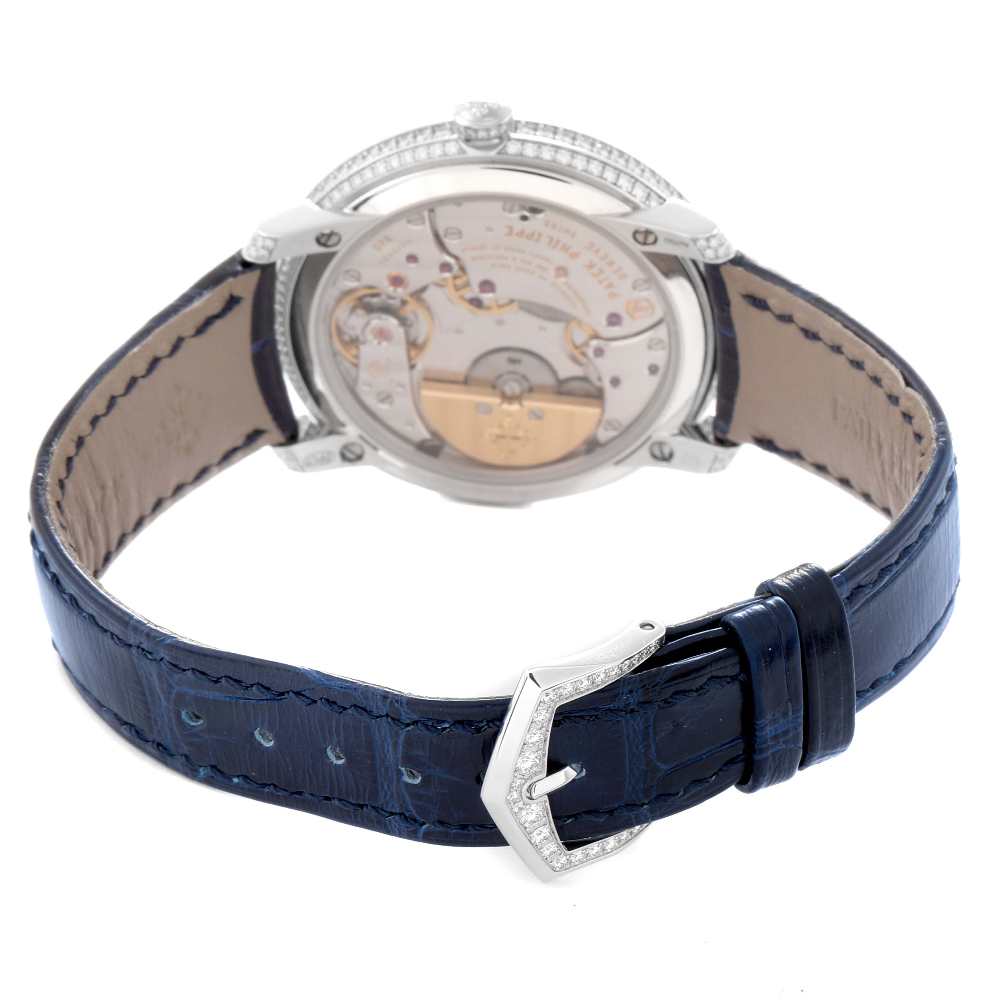 The image shows the back view of a Patek Philippe Calatrava 4978/400G-001 Men
s White Gold Silver Dial 4978/400G-001 Men
s White Gold Silver Dial watch, highlighting the movement and the blue leather strap.