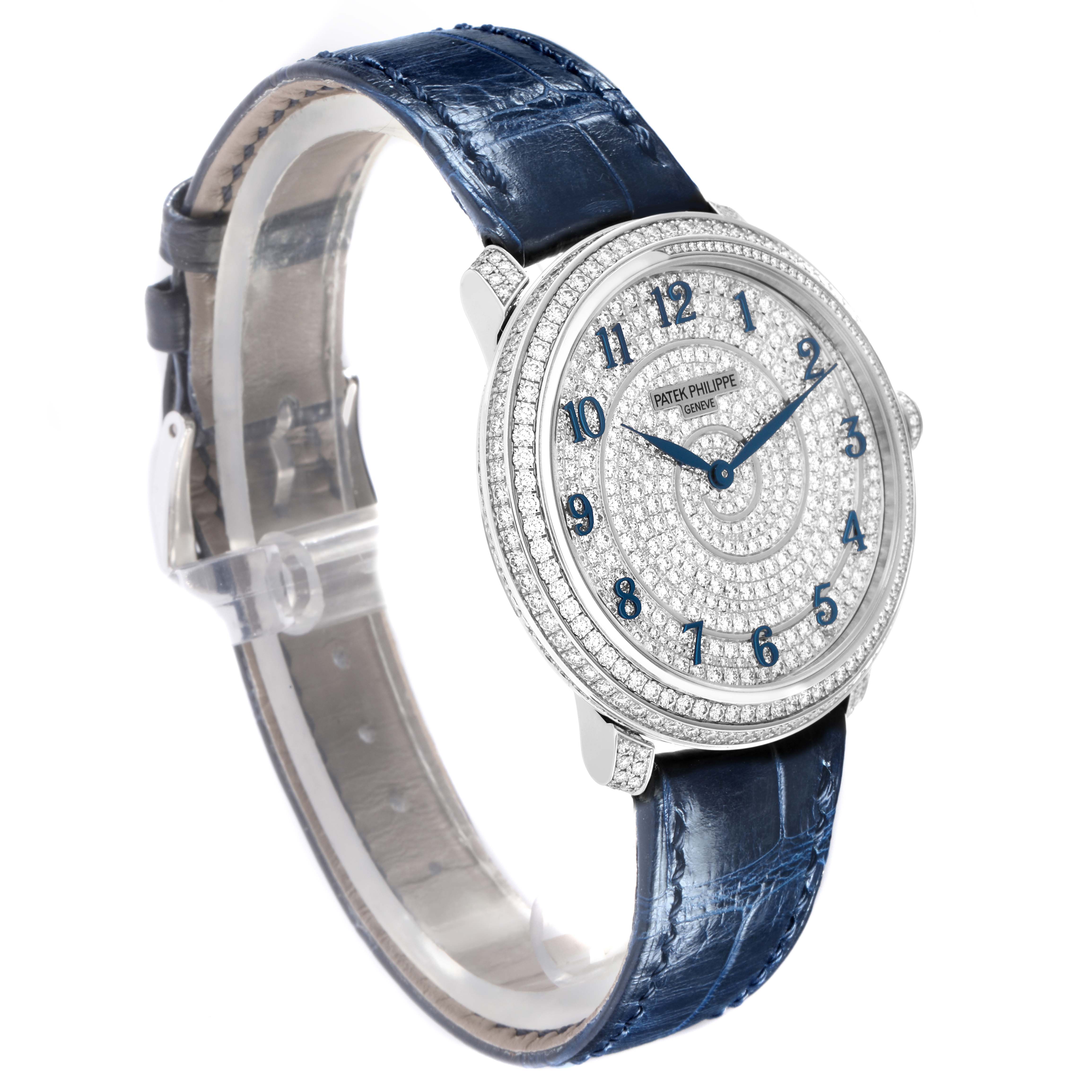 The Patek Philippe Calatrava 4978/400G-001 Men
s White Gold Silver Dial 4978/400G-001 Men
s White Gold Silver Dial watch is shown at a three-quarter angle, featuring a diamond-set dial and a blue leather strap.