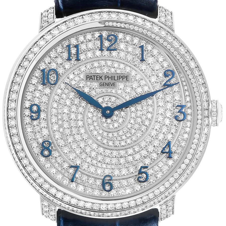 The Patek Philippe Calatrava watch is shown from a front angle, highlighting the diamond-encrusted dial and bezel.