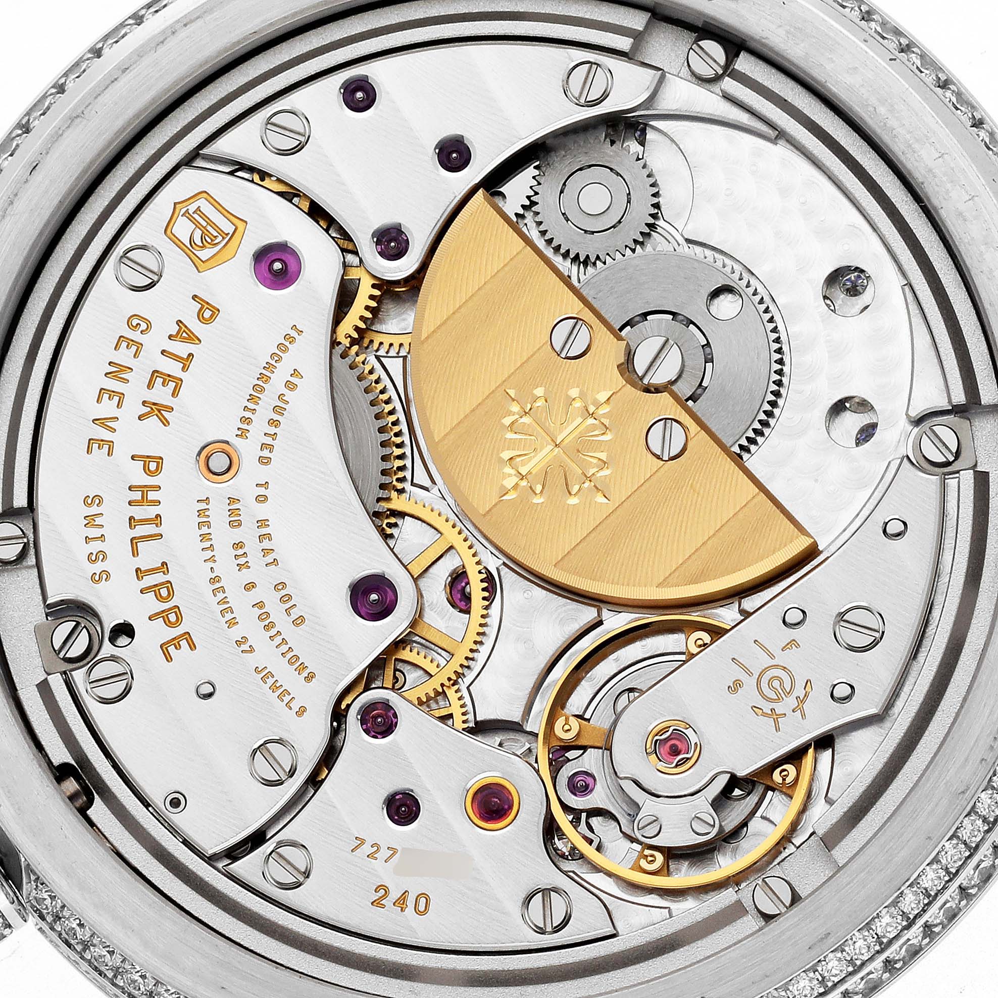 This image shows the movement of a Patek Philippe Calatrava 4978/400G-001 Men
s White Gold Silver Dial 4978/400G-001 Men
s White Gold Silver Dial watch from a close-up angle, highlighting its intricate gears and components.