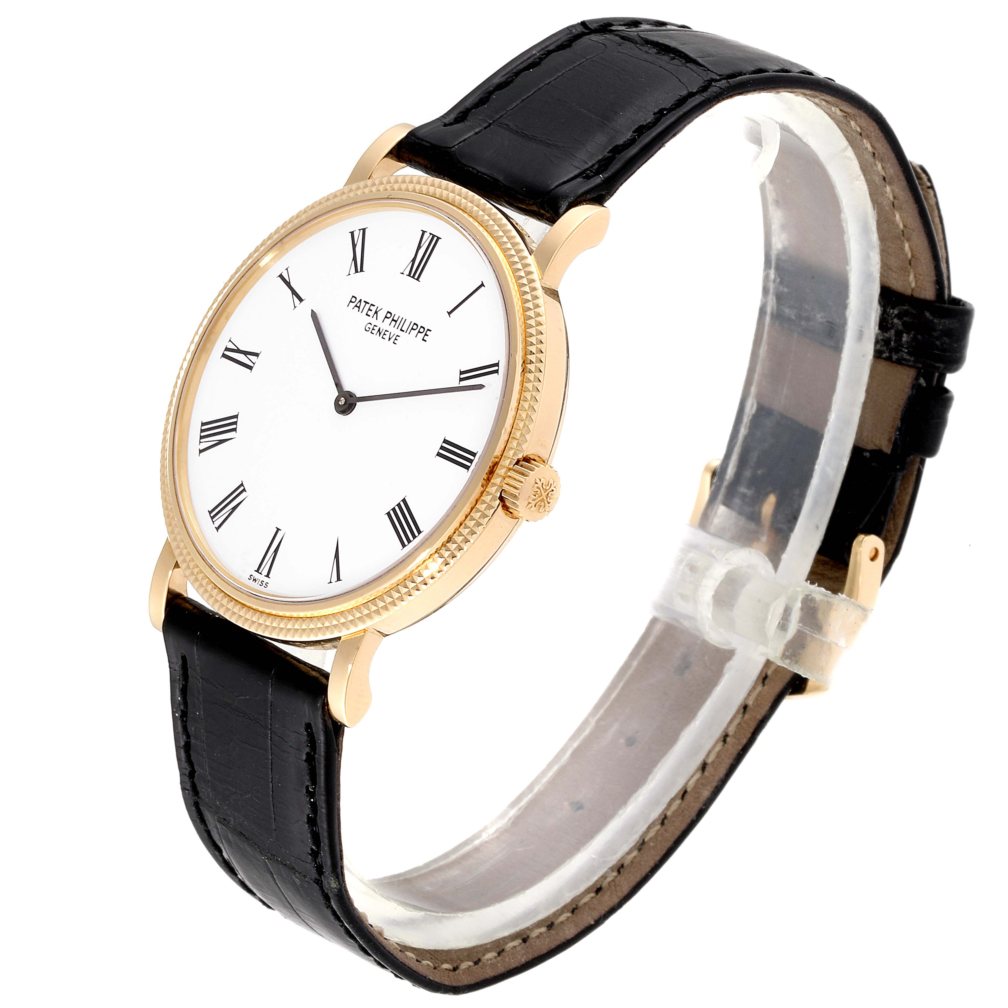 The Calatrava model by Patek Philippe is shown at a slight angle, highlighting the watch's face, crown, and black leather strap.